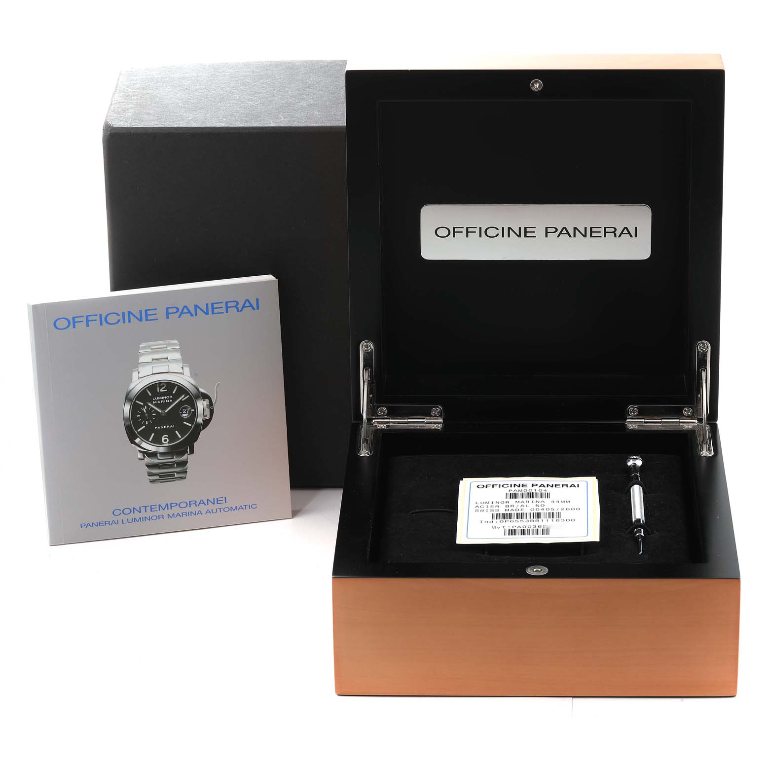 The image shows an open Panerai Luminor PAM00104 Men's Stainless Steel Black Dial PAM00104 Men's Stainless Steel Black Dial watch box, a booklet, and a tool, viewed from the front.