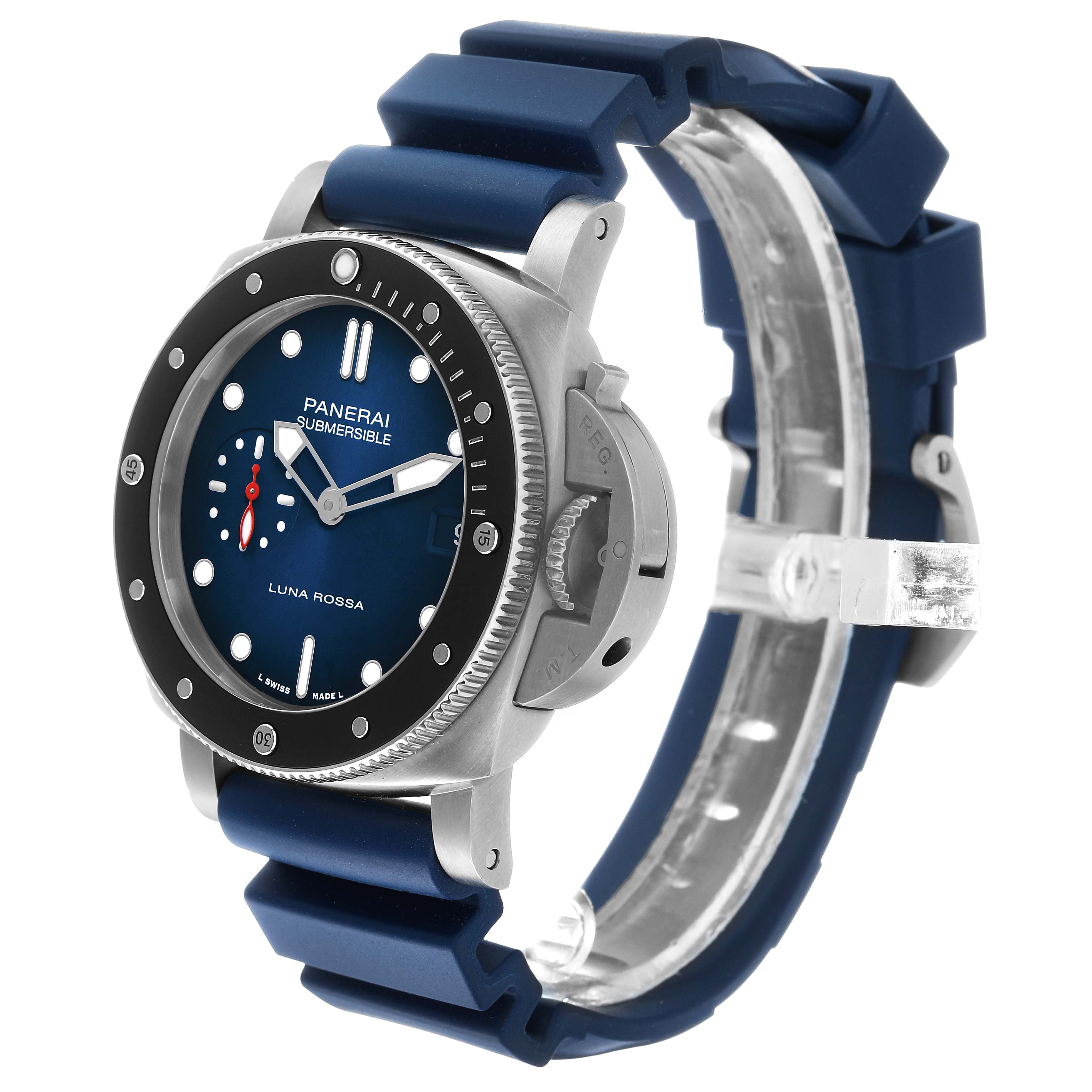 The Panerai Submersible PAM01565 Men's Stainless Steel Blue Dial watch is shown in a three-quarter view, highlighting the bezel, dial, crown guard, and blue strap.