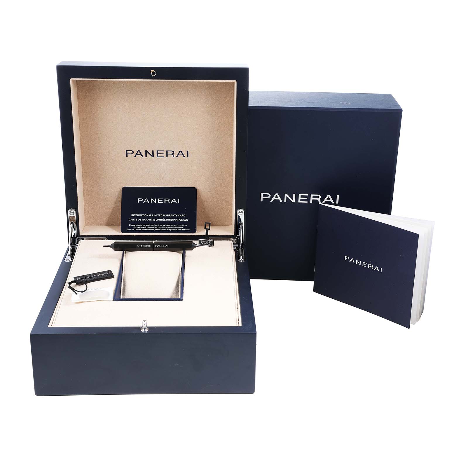 The Panerai Submersible PAM01565 Men's Stainless Steel Blue Dial watch is not shown; the image displays its open box, warranty card, tools, and booklets.