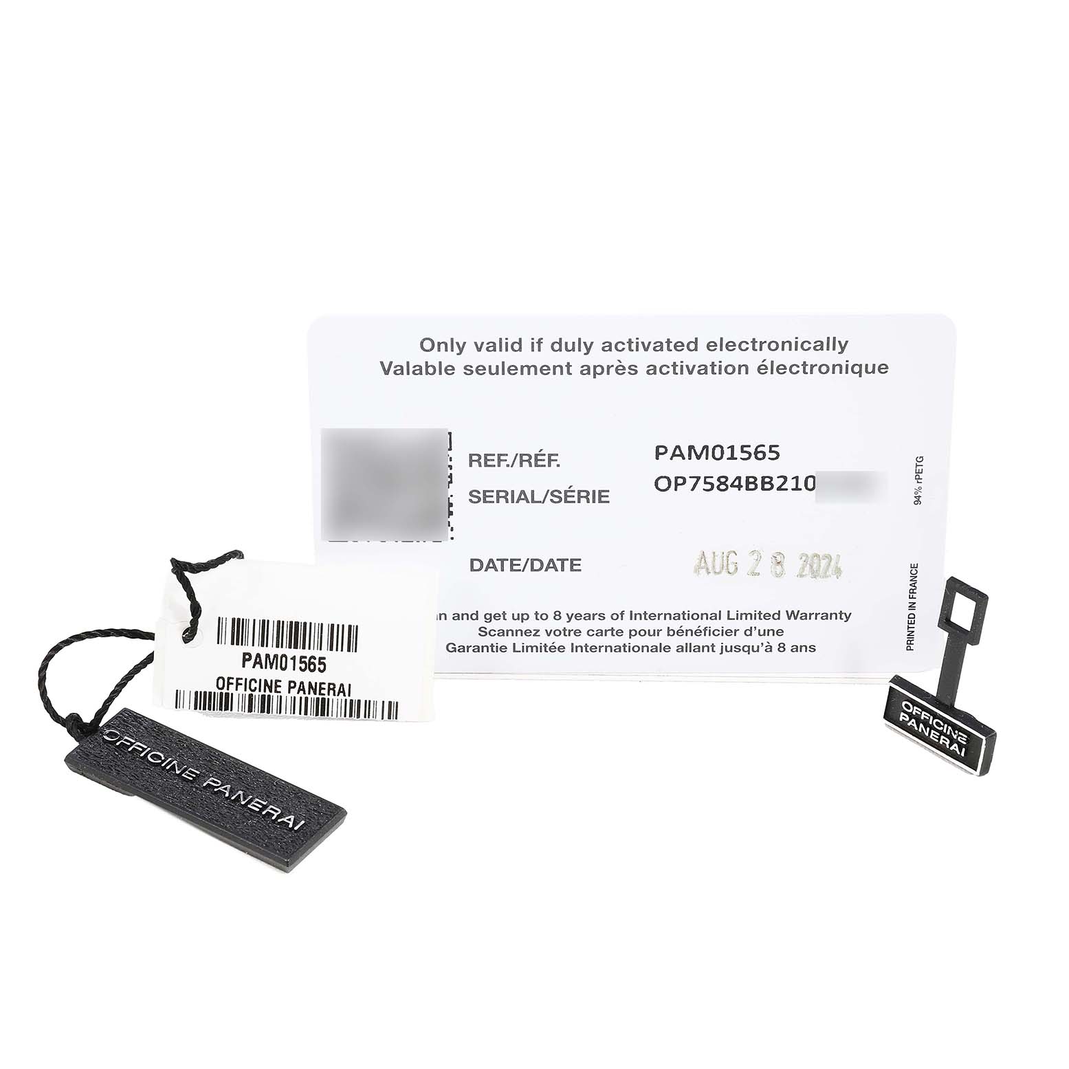 The image shows warranty cards and tags for a Panerai Submersible PAM01565 Men's Stainless Steel Blue Dial watch, featuring reference and serial numbers.