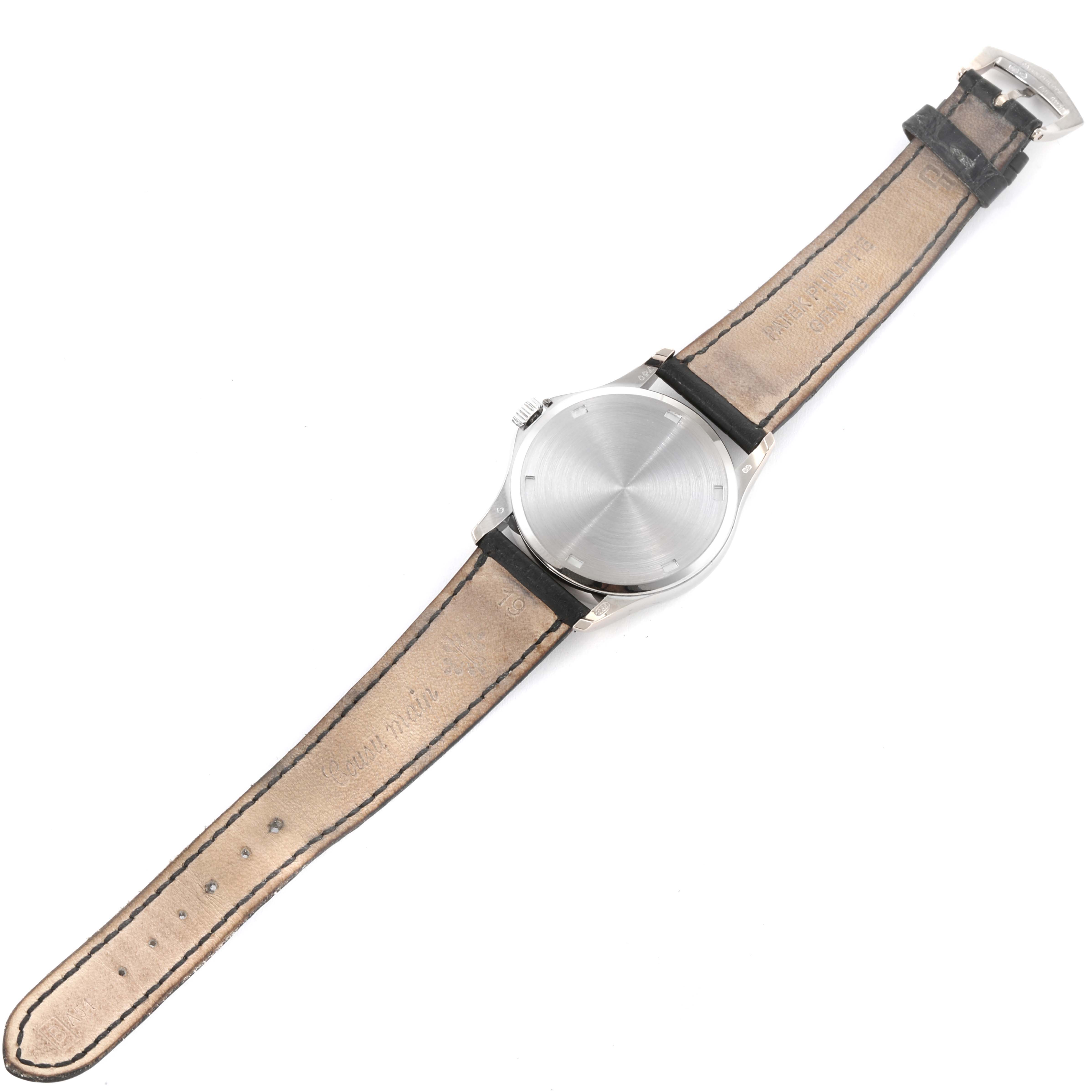 This image shows the back view of a Patek Philippe Calatrava 5115G-001 Men's White Gold White Dial 5115G-001 Men's White Gold White Dial watch with its leather strap fully extended.