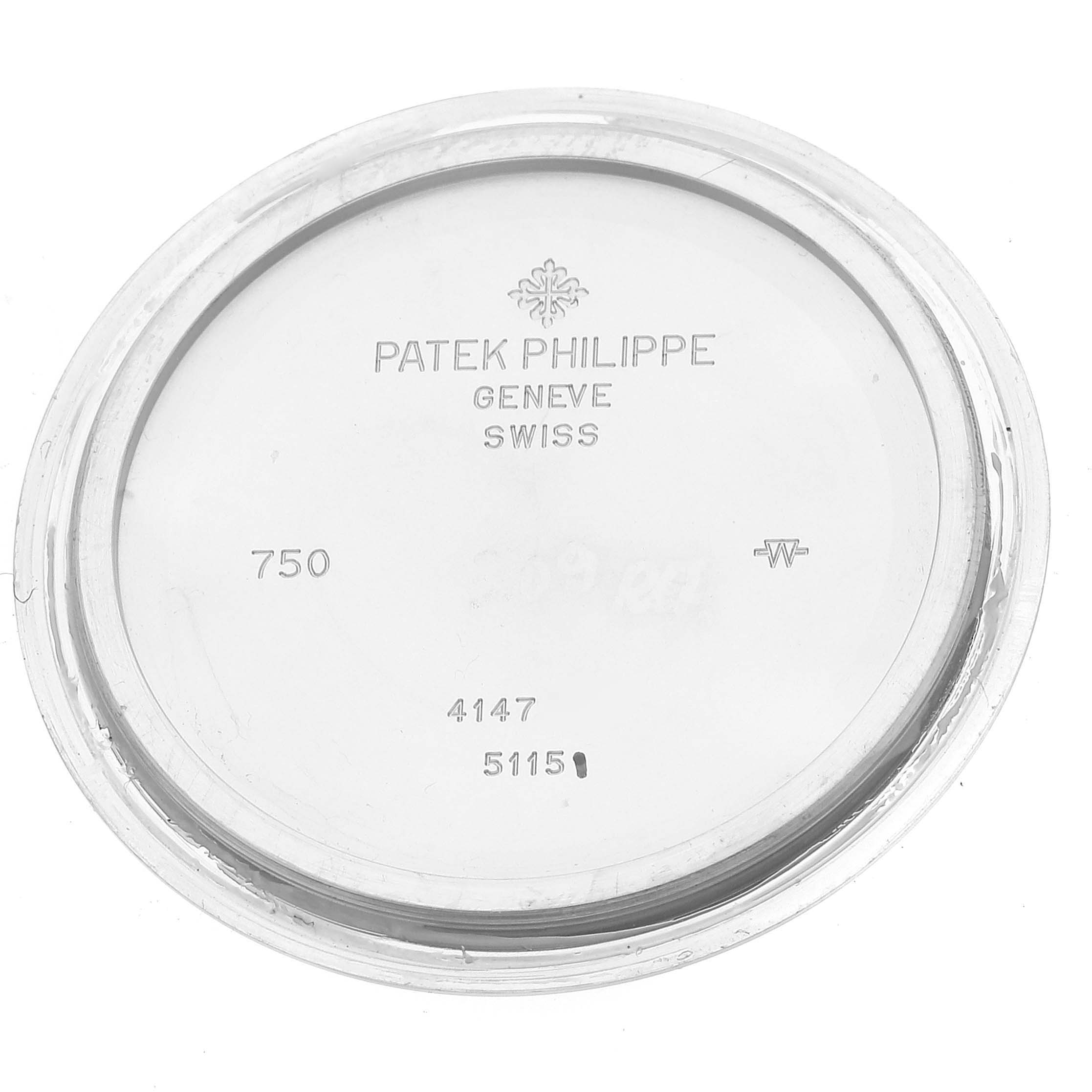 This image shows the back cover of a Patek Philippe Calatrava 5115G-001 Men's White Gold White Dial 5115G-001 Men's White Gold White Dial watch, featuring brand markings and model numbers.