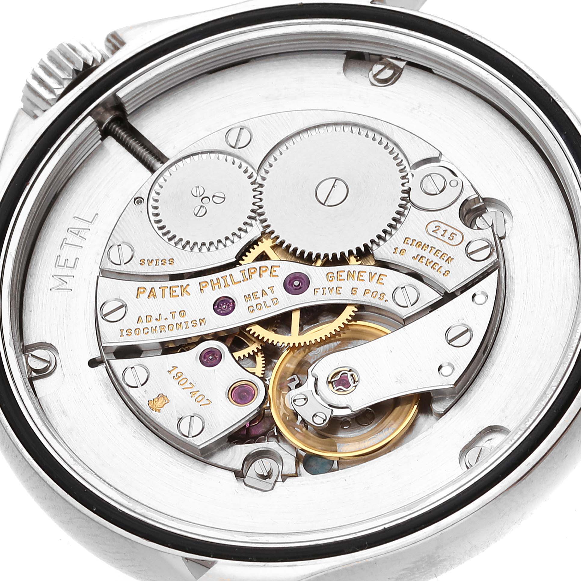 The image shows the inner mechanical movement of a Patek Philippe Calatrava 5115G-001 Men's White Gold White Dial 5115G-001 Men's White Gold White Dial watch, with visible gears and inscriptions.