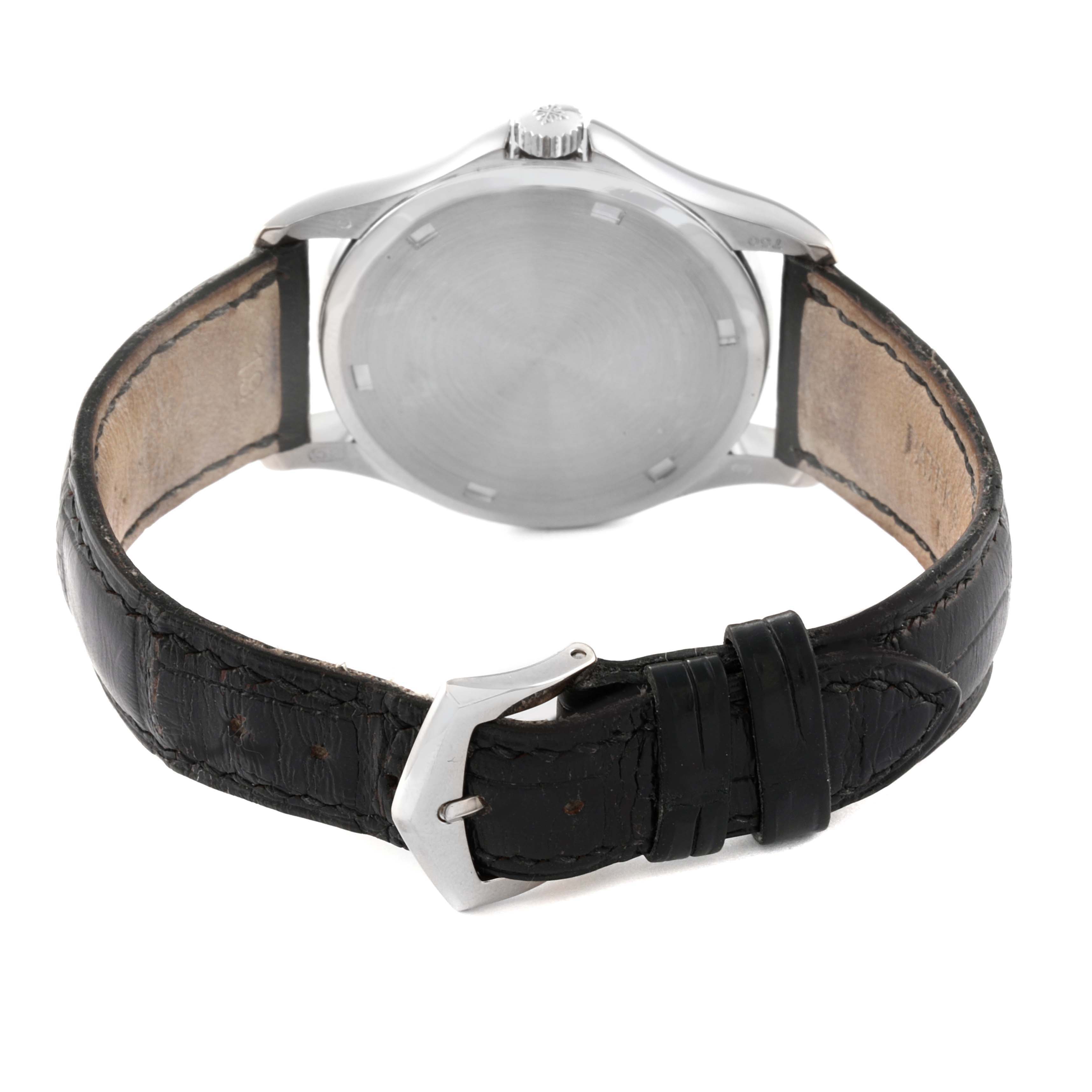 The image shows the back view of a Patek Philippe Calatrava 5115G-001 Men's White Gold White Dial 5115G-001 Men's White Gold White Dial watch, highlighting the case back and black leather strap with buckle.