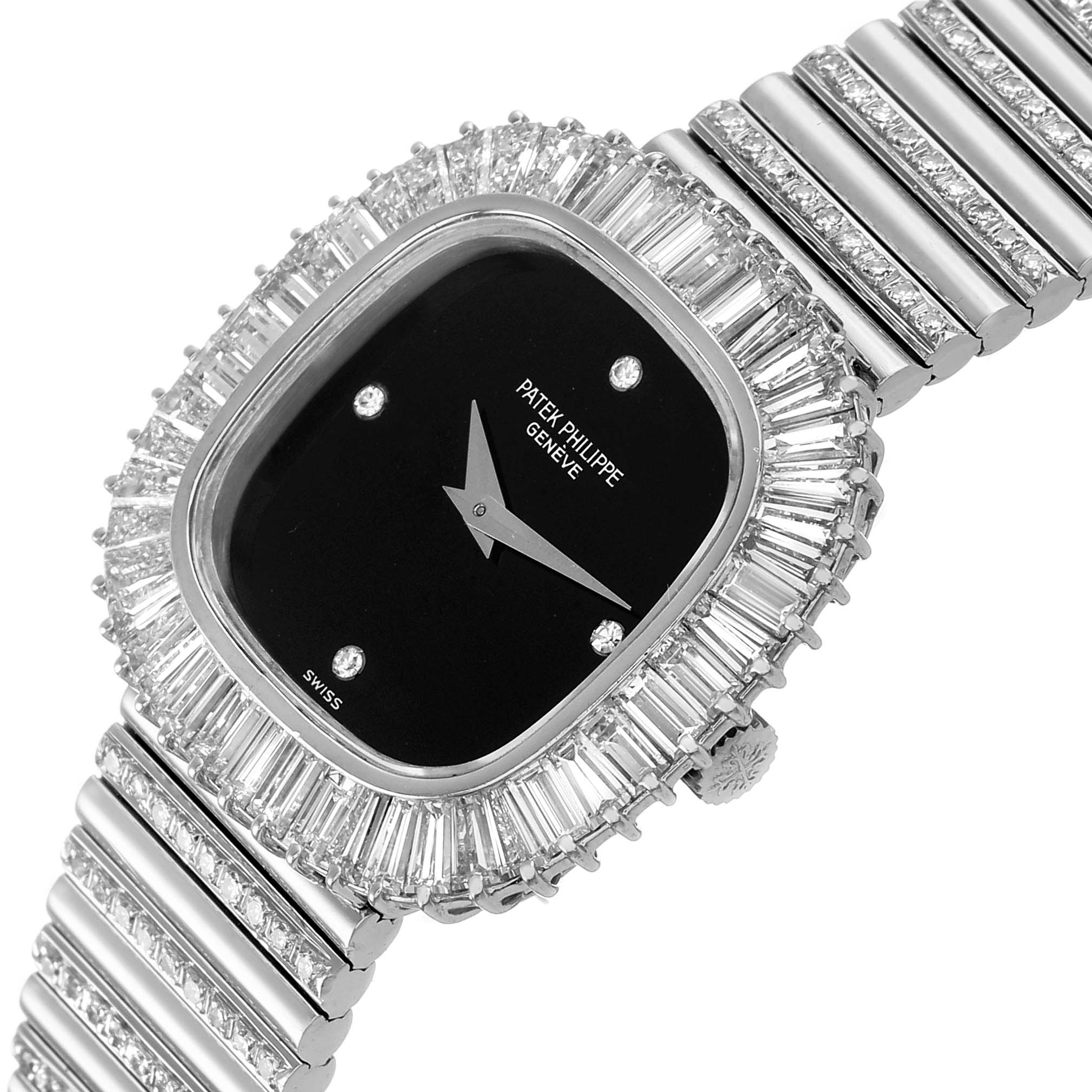 The Patek Philippe Vintage 4432/1 Women's White Gold Black Dial watch is shown at an angled top view, highlighting its diamond-studded bezel and integrated bracelet.