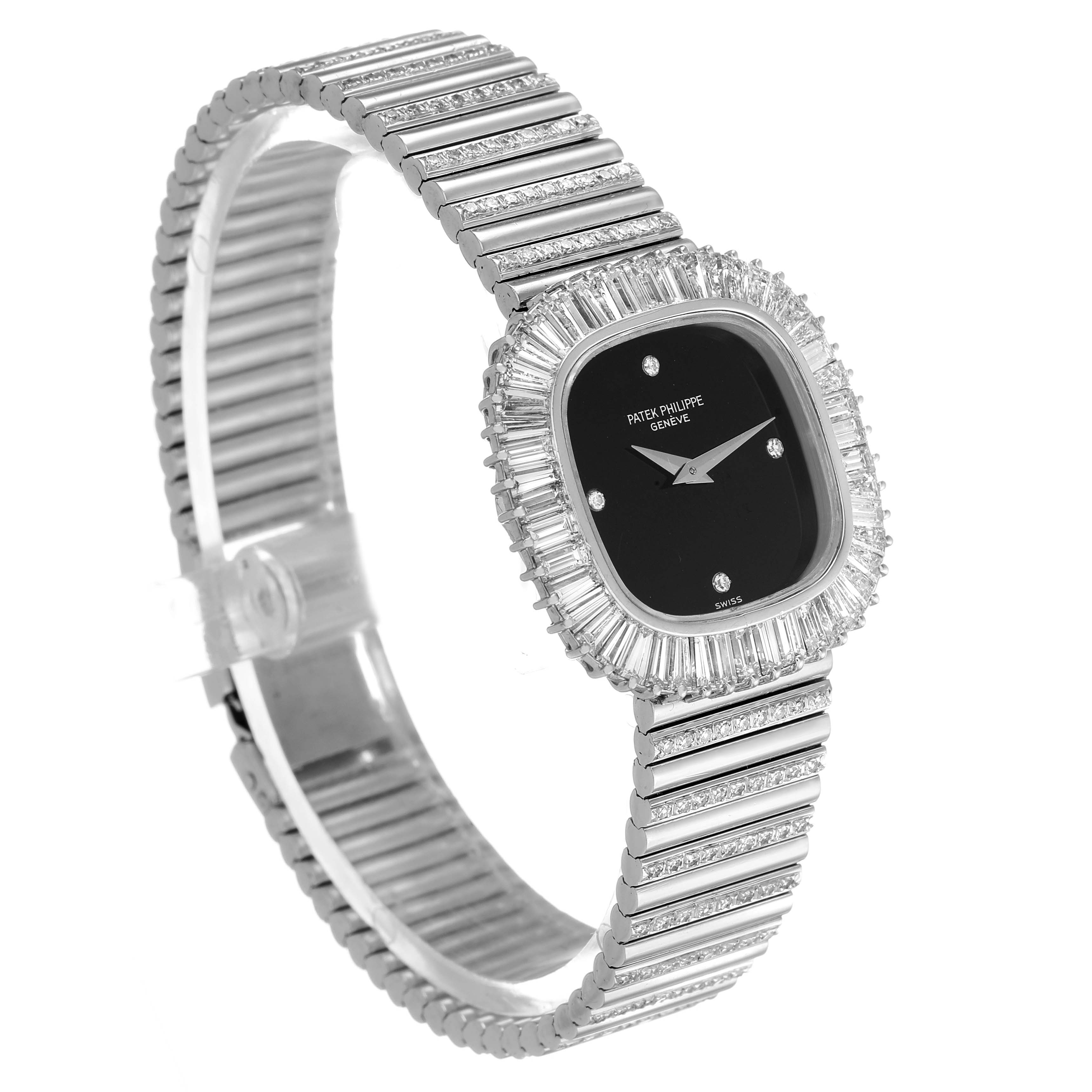 The Vintage Patek Philippe watch is shown at a three-quarter angle, highlighting its face, bezel, and bracelet.