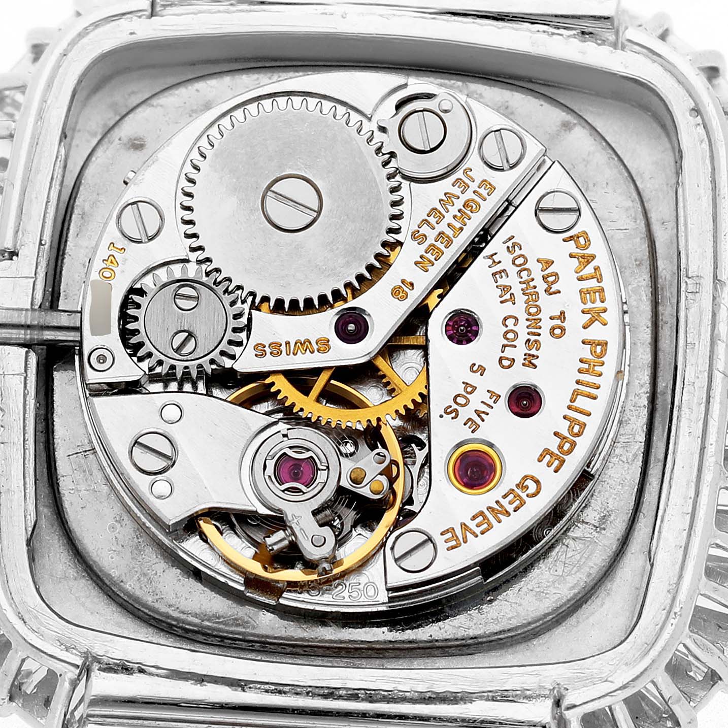 This image shows the open mechanical movement of a Vintage Patek Philippe watch, highlighting gears and intricate details.