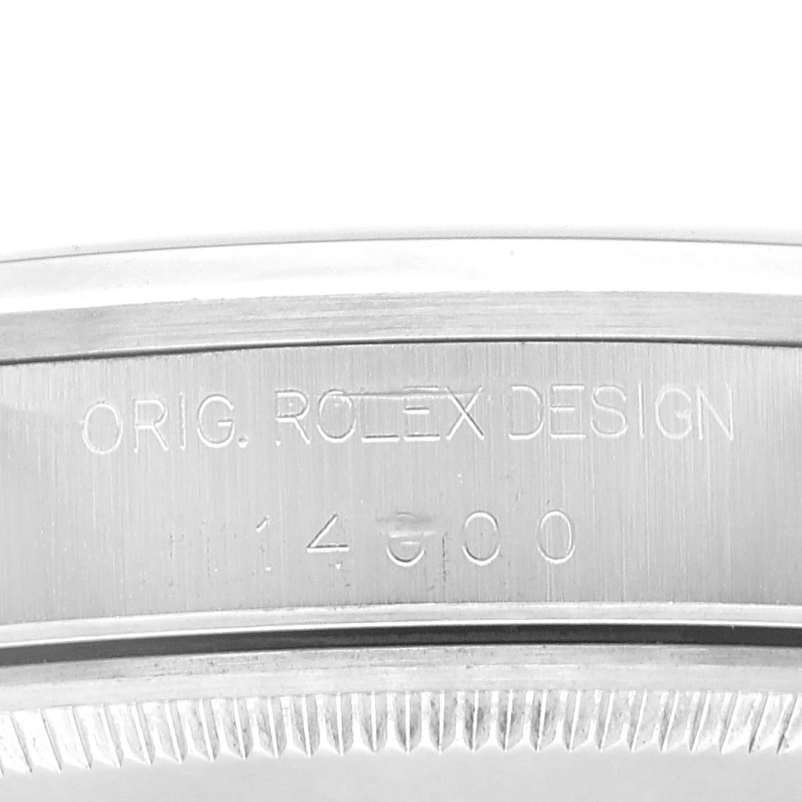 This close-up image of a Rolex Air-King 14000 Men's Stainless Steel Blue Dial 14000 Men's Stainless Steel Blue Dial watch shows the side engraving with "ORIG. ROLEX DESIGN" and the model number.