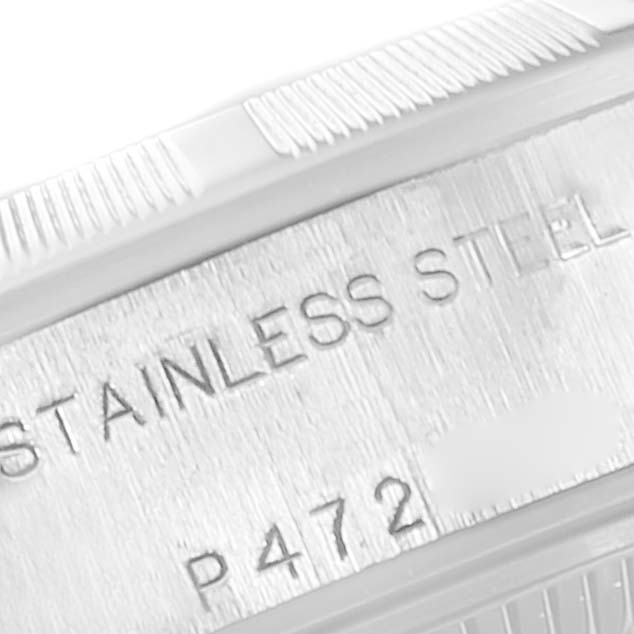 This close-up image shows the side of the stainless steel case and fluted bezel of a Rolex Date 79190 Women
s Stainless Steel Black Dial 79190 Women
s Stainless Steel Black Dial model watch.