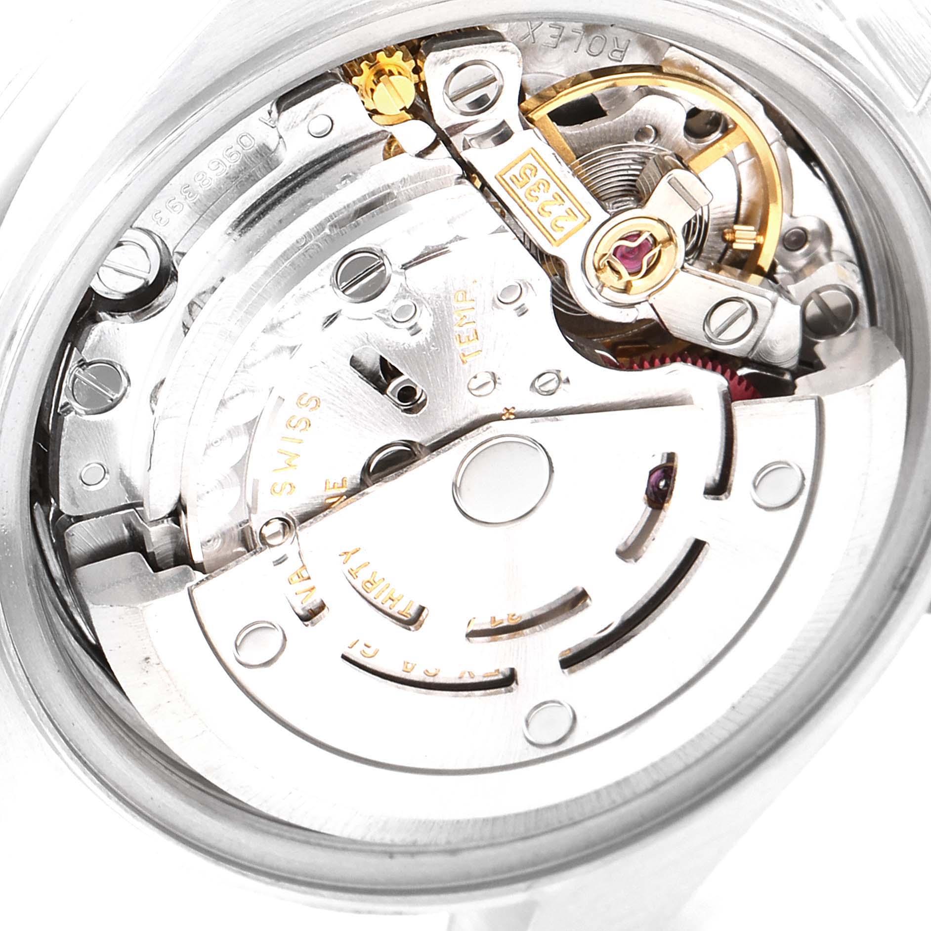 This image shows a close-up of the Rolex Date 79160 Women
s Stainless Steel Silver Dial 79160 Women
s Stainless Steel Silver Dial watch movement mechanism from the rear.