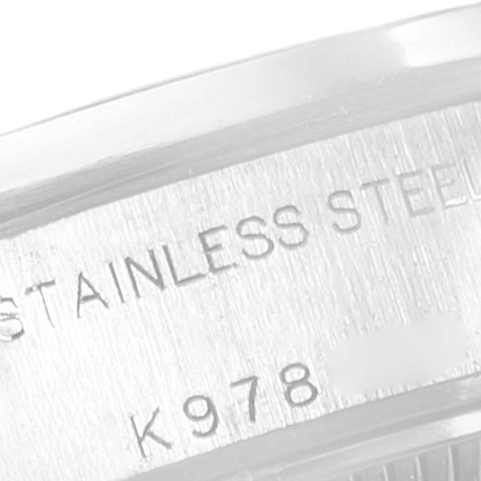 This image shows the stainless steel caseback of a Rolex Date 79160 Women
s Stainless Steel Silver Dial 79160 Women
s Stainless Steel Silver Dial model, highlighting part of its serial number.