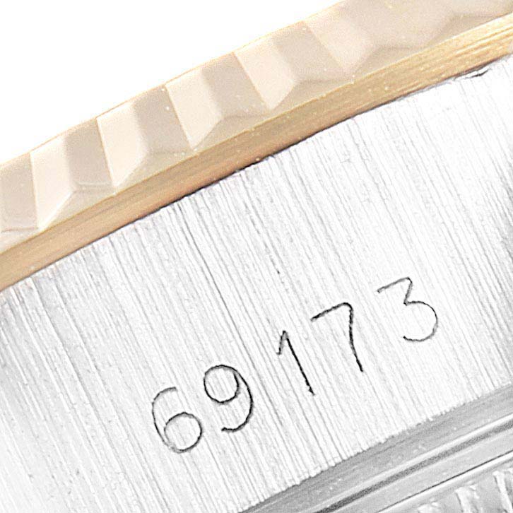 This image shows the serial number and fluted bezel of a Rolex Datejust 69173 Women's Steel and Gold (two tone) Champagne Dial 69173 Women's Steel and Gold (two tone) Champagne Dial watch, model 69173.