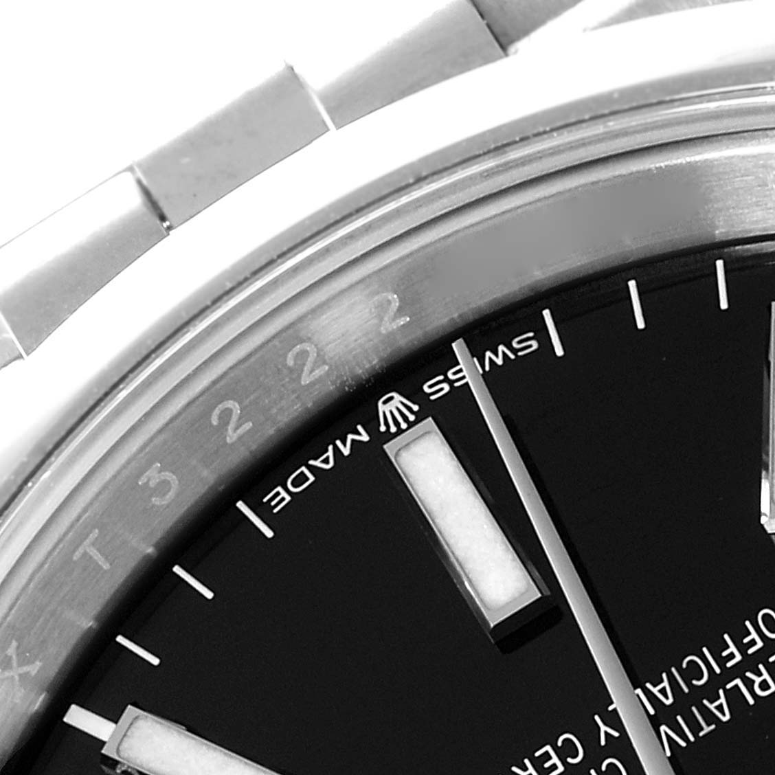 This close-up image shows the face, hands, Swiss Made label, and part of the bracelet of a Rolex Datejust 126200 Men
s Stainless Steel Black Dial 126200 Men
s Stainless Steel Black Dial watch.