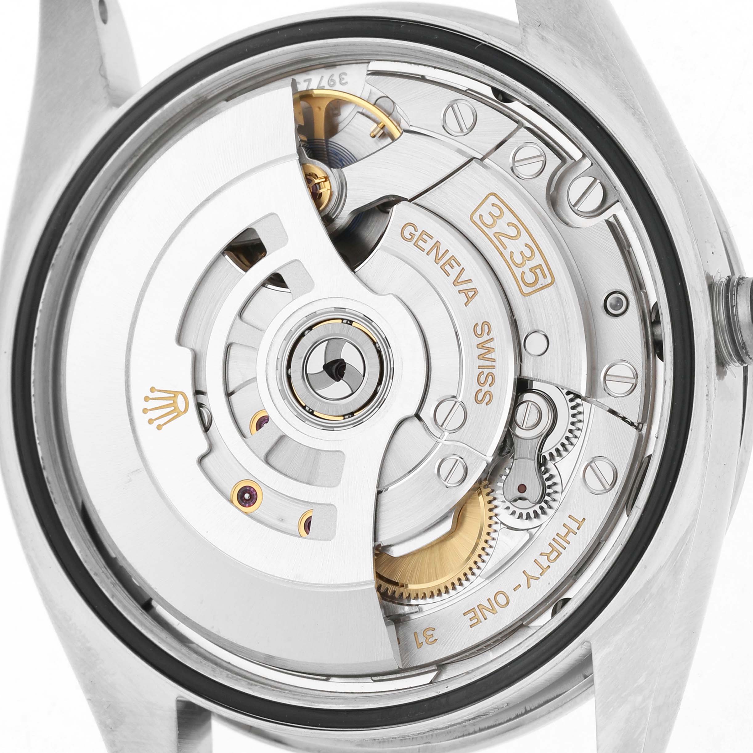 The image shows the movement of a Rolex Datejust 126284 Men's Stainless Steel Purple Dial watch from a top-down perspective, highlighting its intricate mechanisms.