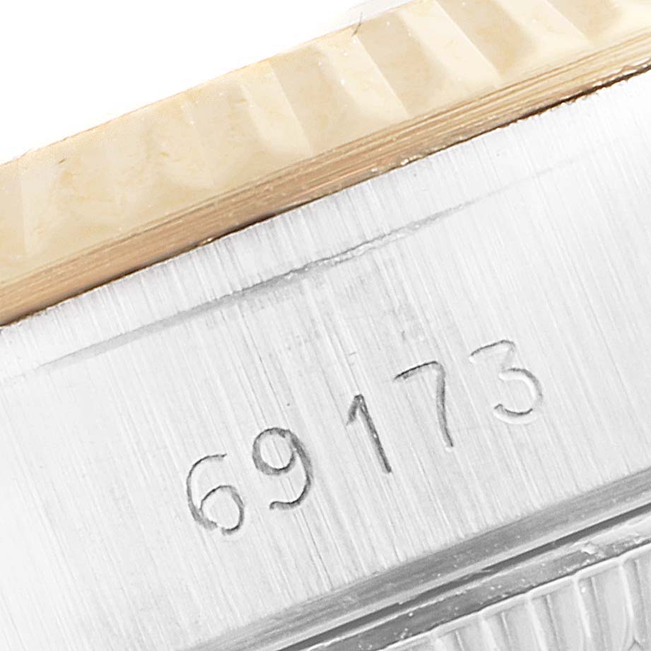 The image shows a close-up of the model number 69173 engraved on the case of a Rolex Datejust 69173 Women's Steel and Gold (two tone) Champagne Dial 69173 Women's Steel and Gold (two tone) Champagne Dial watch, near the fluted bezel.