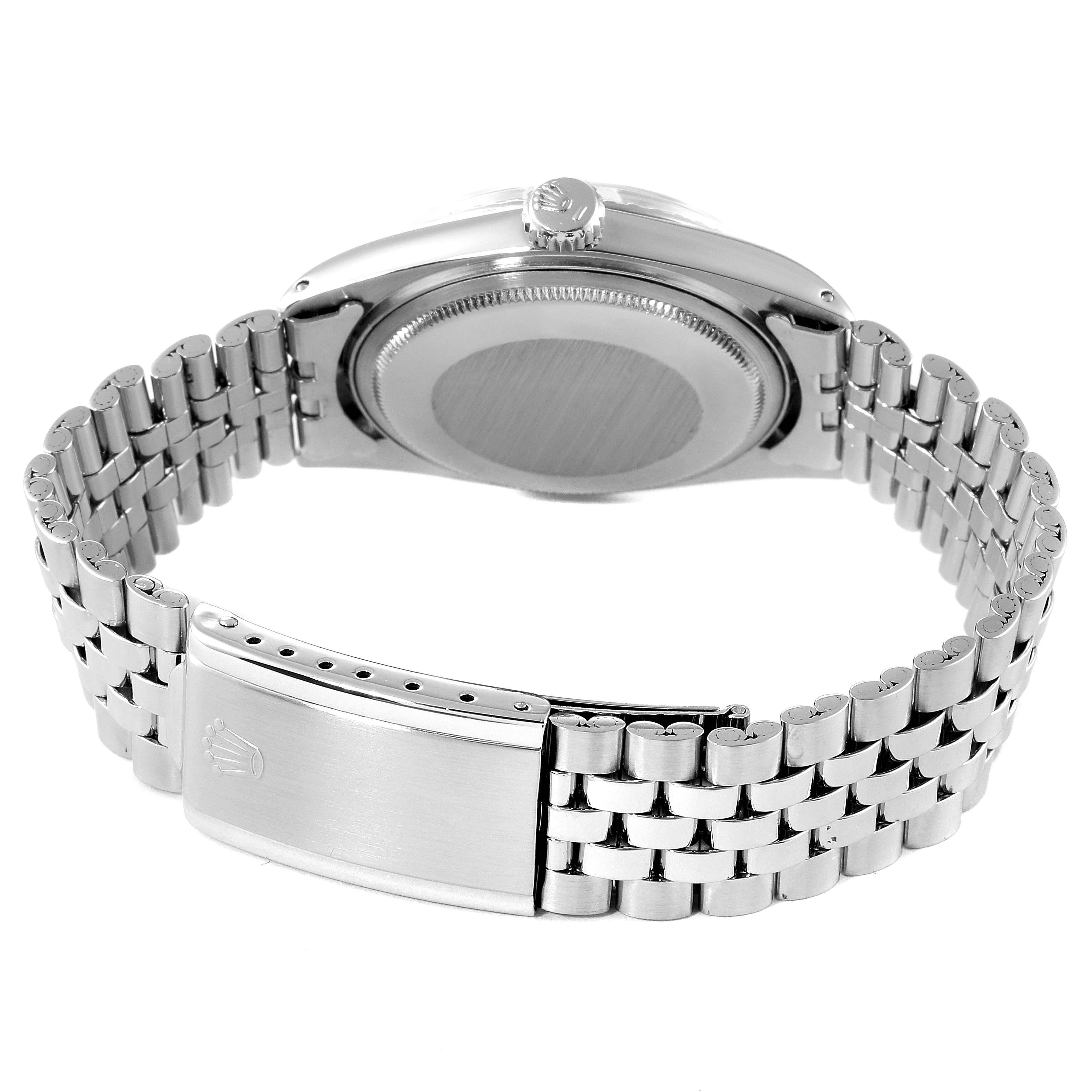 The image shows the back view of a Rolex Vintage Collection 1603 Men
s Stainless Steel Silver Dial 1603 Men
s Stainless Steel Silver Dial watch, highlighting the clasp and case back.