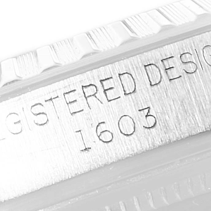 The image shows a close-up of the side case of the Rolex Vintage Collection 1603 Men
s Stainless Steel Silver Dial 1603 Men
s Stainless Steel Silver Dial model 1603, highlighting engraved text.