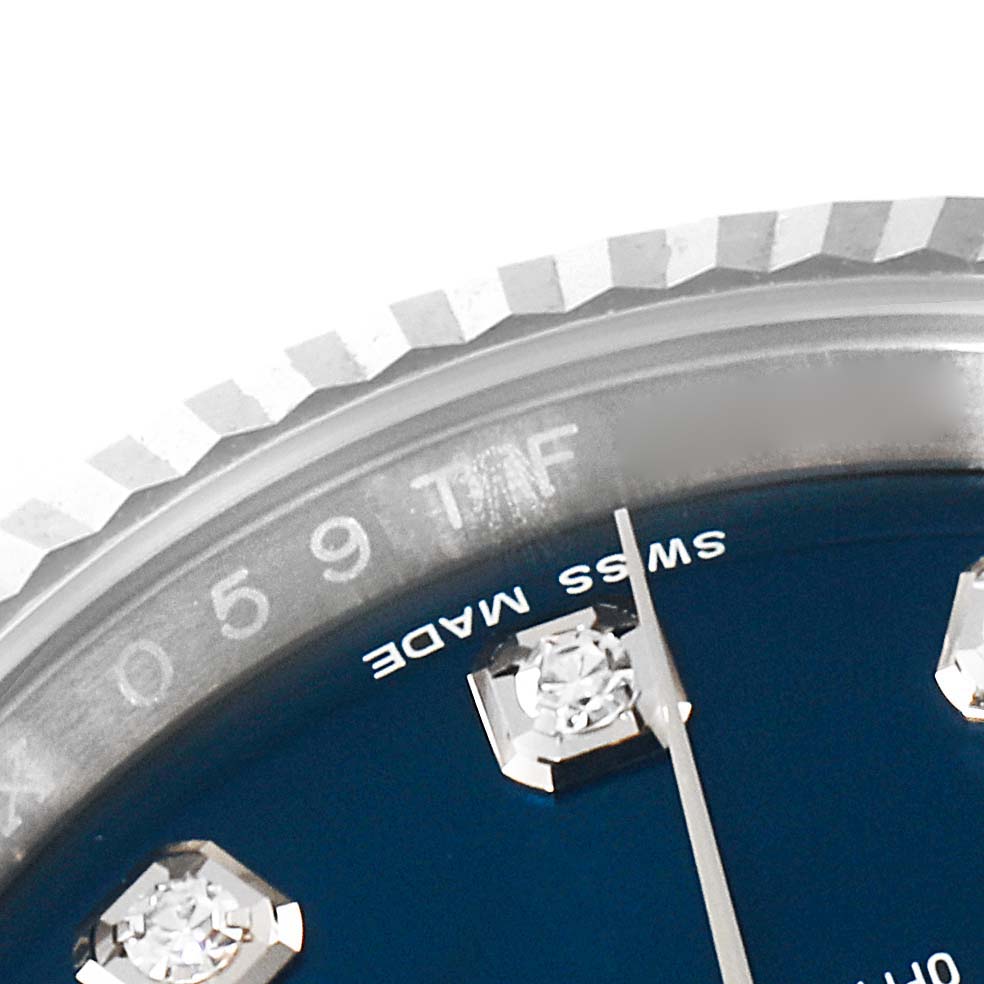 The image shows a close-up of the dial and bezel of a Rolex Datejust 116234 Men's Stainless Steel Blue Dial 116234 Men's Stainless Steel Blue Dial watch, highlighting the "SWISS MADE" text and diamond hour markers.