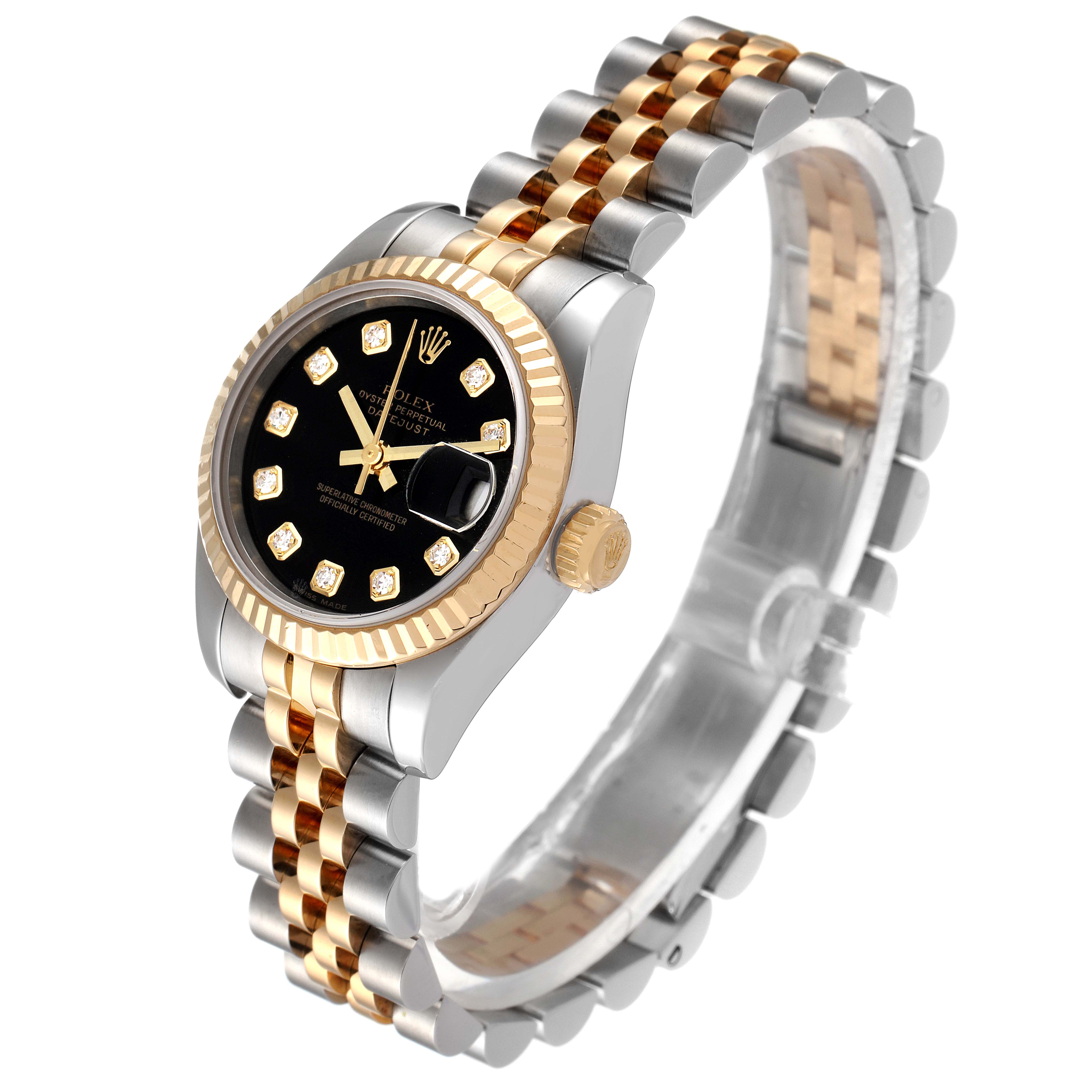 The image shows a Rolex Datejust 179173 Women's Steel and Gold (two tone) Black Dial 179173 Women's Steel and Gold (two tone) Black Dial watch at an angle highlighting its black dial, two-tone bracelet, and fluted bezel.