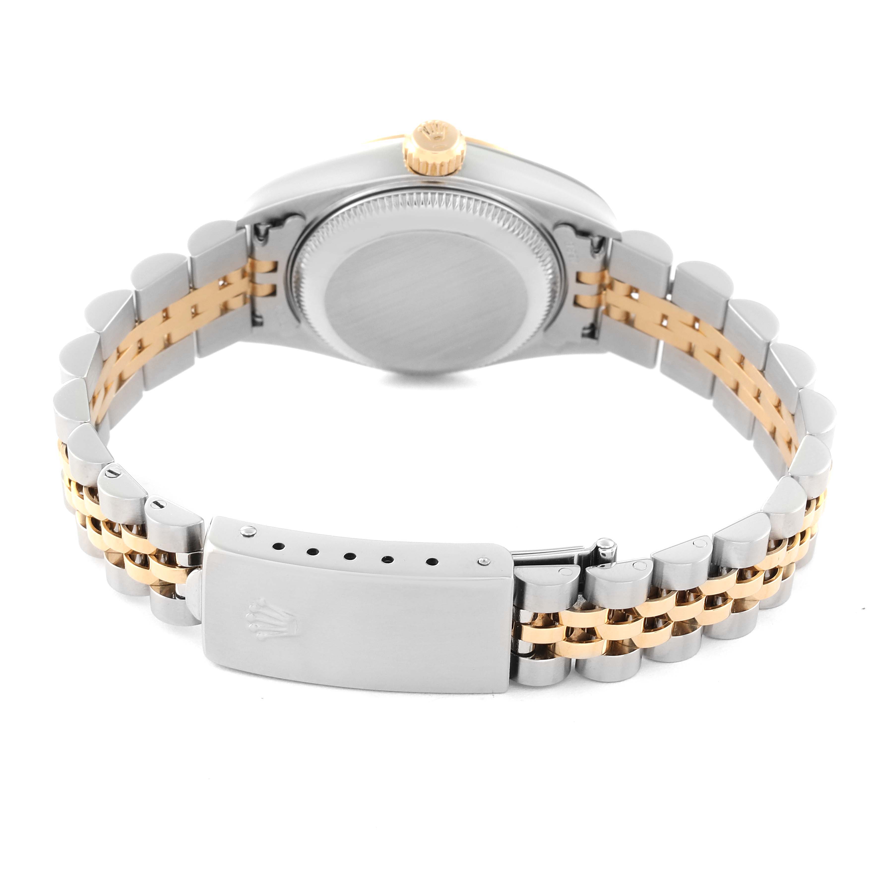 The image shows the back view of a Rolex Datejust 79173 Women's Steel and Gold (two tone) Champagne Dial 79173 Women's Steel and Gold (two tone) Champagne Dial watch, highlighting its case back, crown, and two-tone bracelet with a clasp.