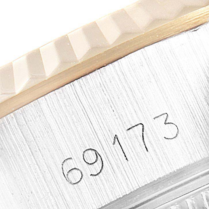 This close-up image shows the engraved reference number on the case side of a Rolex Datejust 69173 Women's Steel and Gold (two tone) Champagne Dial 69173 Women's Steel and Gold (two tone) Champagne Dial watch.