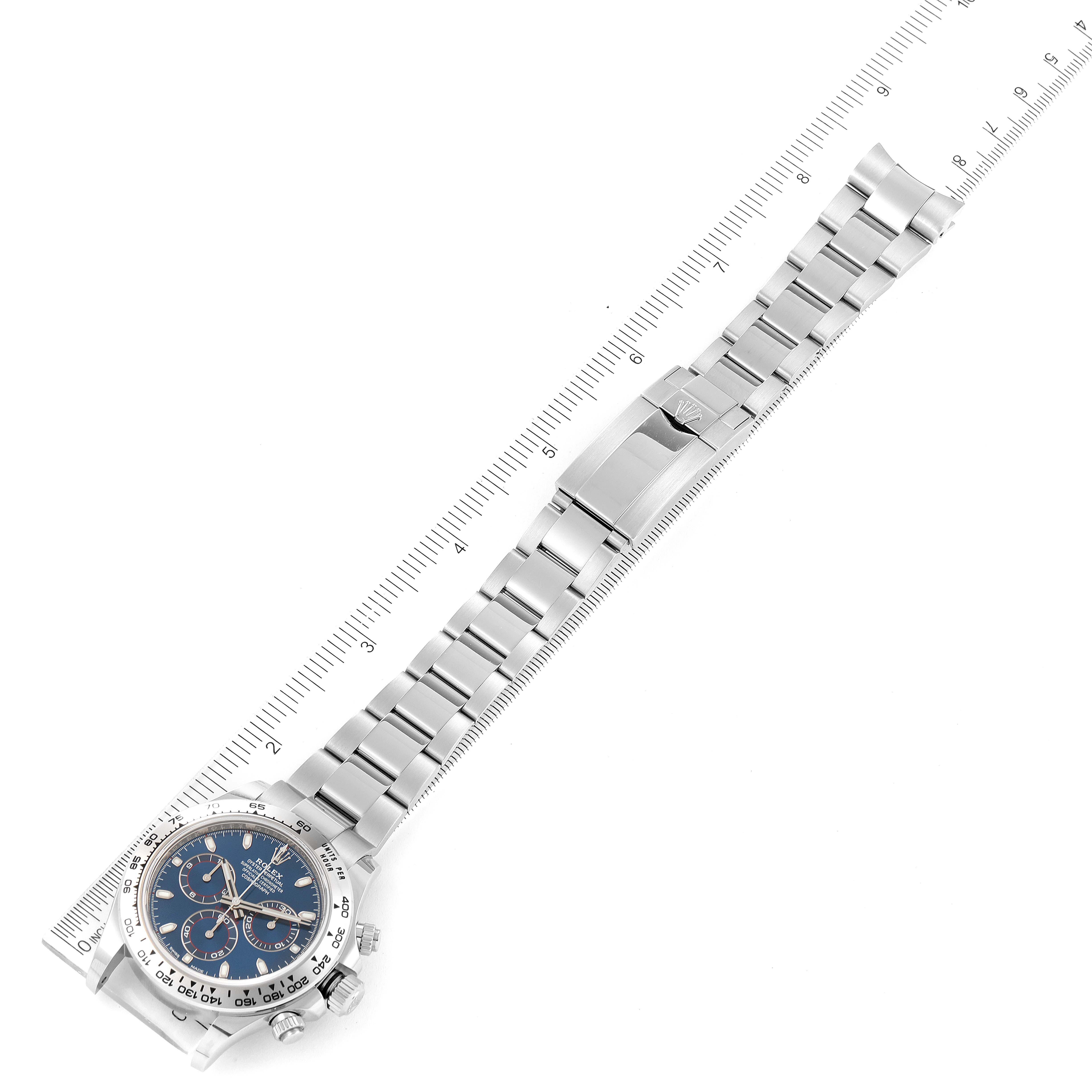 The image shows a Rolex Daytona 116509 Men's White Gold Blue Dial 116509 Men's White Gold Blue Dial watch at an oblique angle, highlighting its bracelet and face.