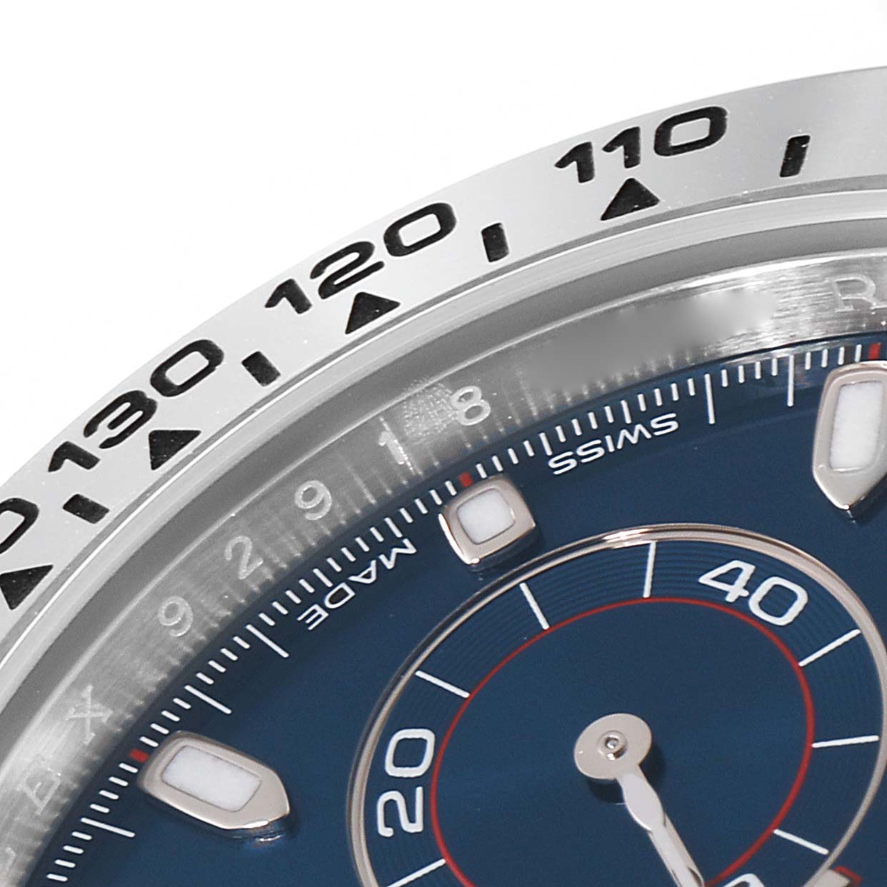 Close-up of the Rolex Daytona 116509 Men's White Gold Blue Dial 116509 Men's White Gold Blue Dial watch, showing part of the bezel and dial with detailed markers.