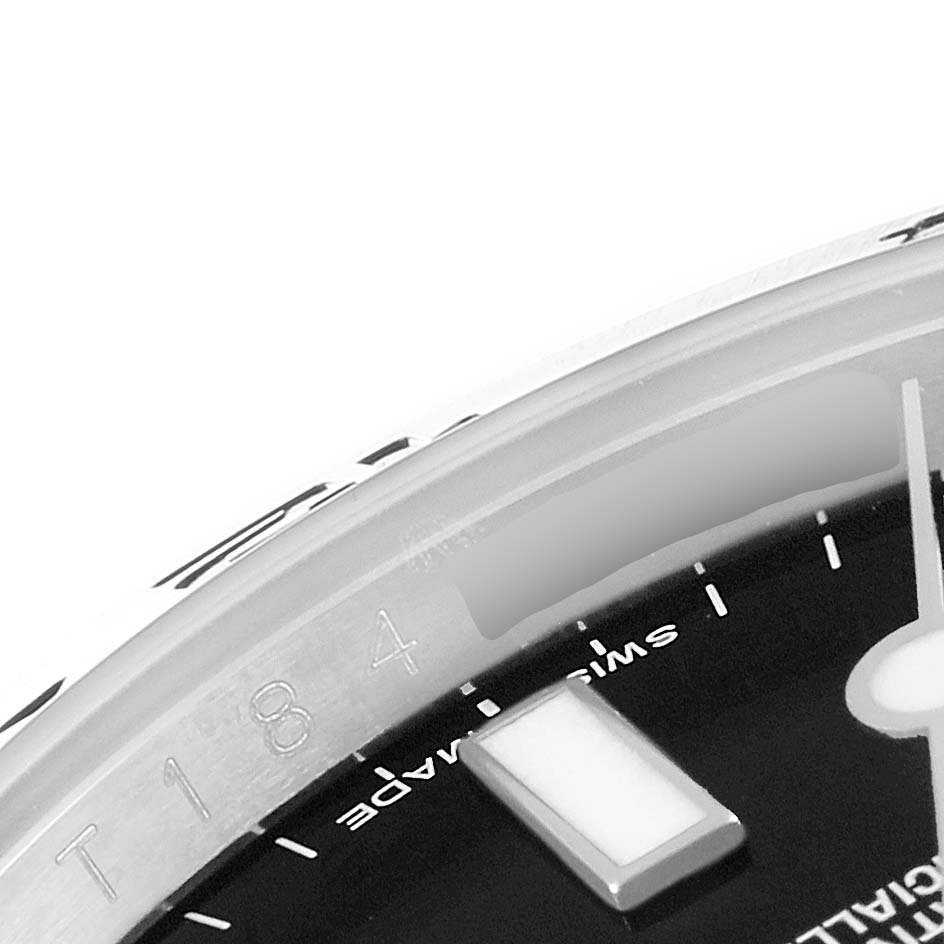 This image shows a close-up of the dial, markers, and part of the bezel of a Rolex Explorer 216570 Men
s Stainless Steel Black Dial 216570 Men
s Stainless Steel Black Dial watch.