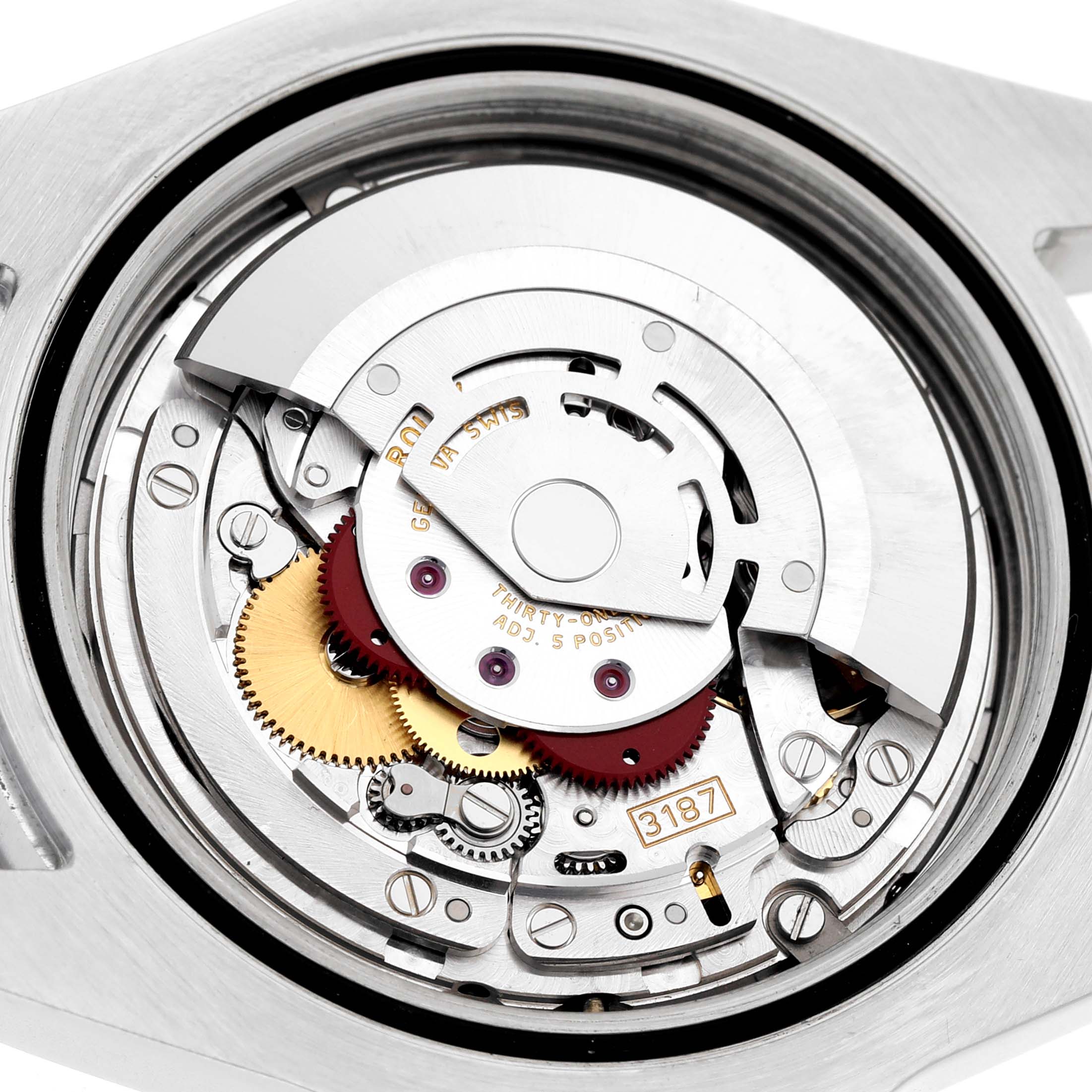 The image shows the movement of a Rolex Explorer 216570 Men's Stainless Steel White Dial watch from the back, revealing gears and the rotor.