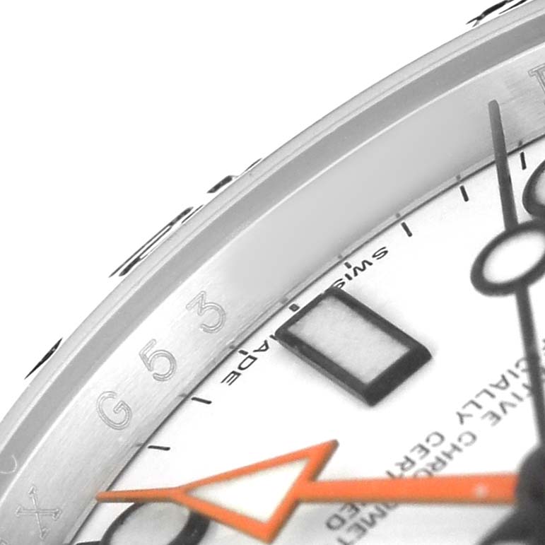 The image shows a close-up angle of the Rolex Explorer 216570 Men's Stainless Steel White Dial watch face, focusing on the bezel, markers, and hands.