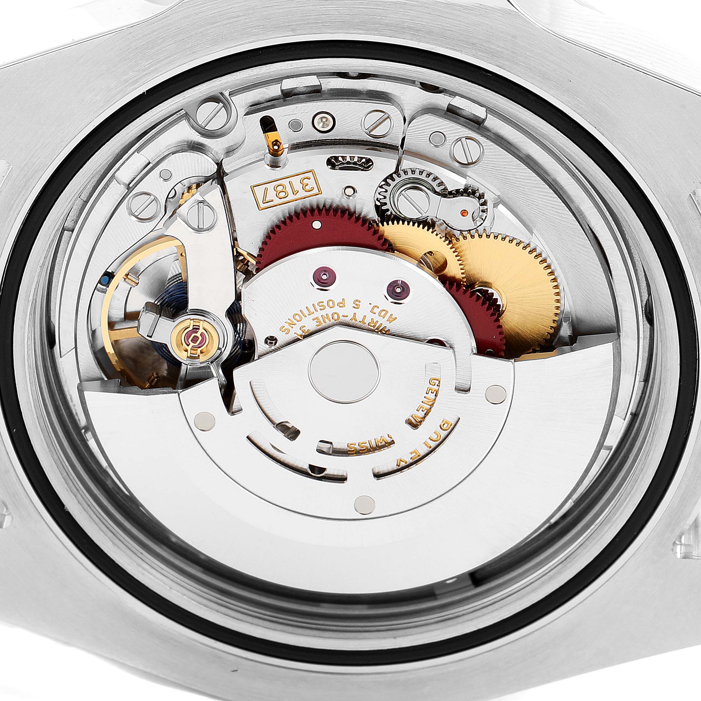 This is a close-up view of the movement inside a Rolex Explorer 216570 Men
s Stainless Steel White Dial 216570 Men
s Stainless Steel White Dial watch, showing intricate gears and mechanical parts.