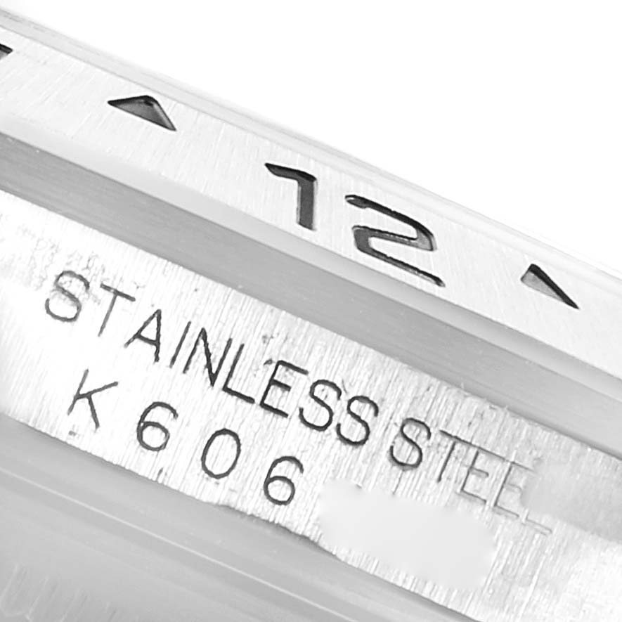 The image shows a close-up of the stainless steel case and part of the dial of a Rolex Explorer 16570 Men
s Stainless Steel Black Dial 16570 Men
s Stainless Steel Black Dial watch model.