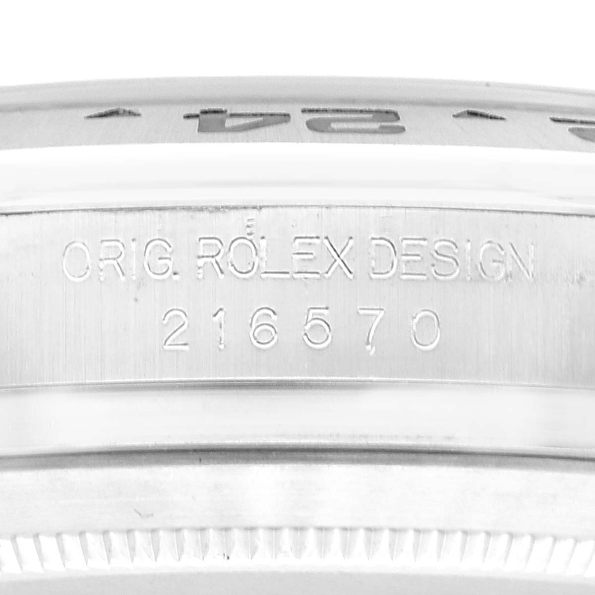 This image shows a close-up of the side of the bezel and case of a Rolex Explorer 216570 Men's Stainless Steel Black Dial 216570 Men's Stainless Steel Black Dial watch, with engraved model details.