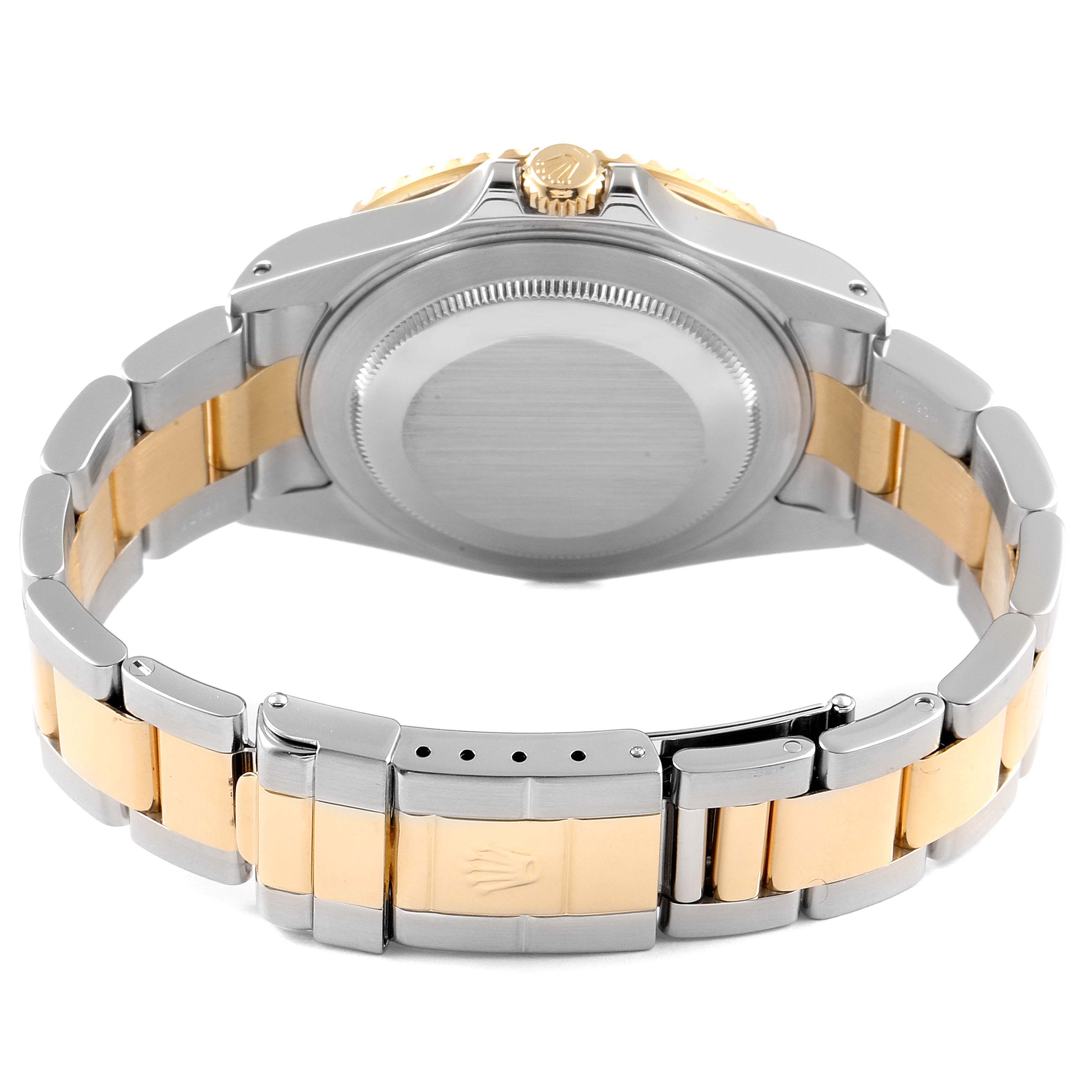 The image shows the back view of a Rolex GMT-Master 16713 Men's Steel and Gold (two tone) Champagne Dial 16713 Men's Steel and Gold (two tone) Champagne Dial watch, focusing on the case, crown, and bi-metal bracelet.