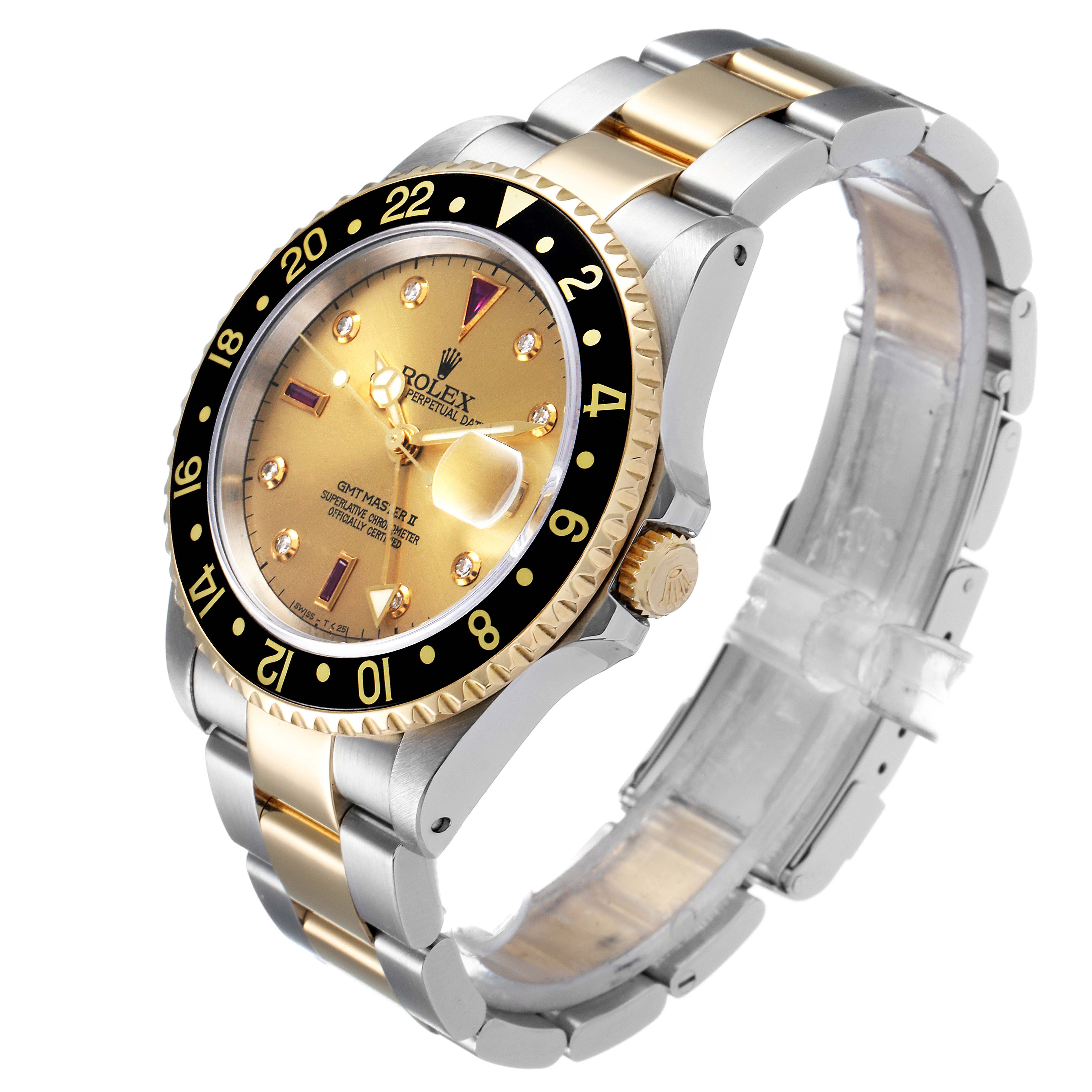 The Rolex GMT-Master 16713 Men's Steel and Gold (two tone) Champagne Dial 16713 Men's Steel and Gold (two tone) Champagne Dial watch is shown at an angled side view, highlighting the gold and silver bracelet, crown, and bezel.