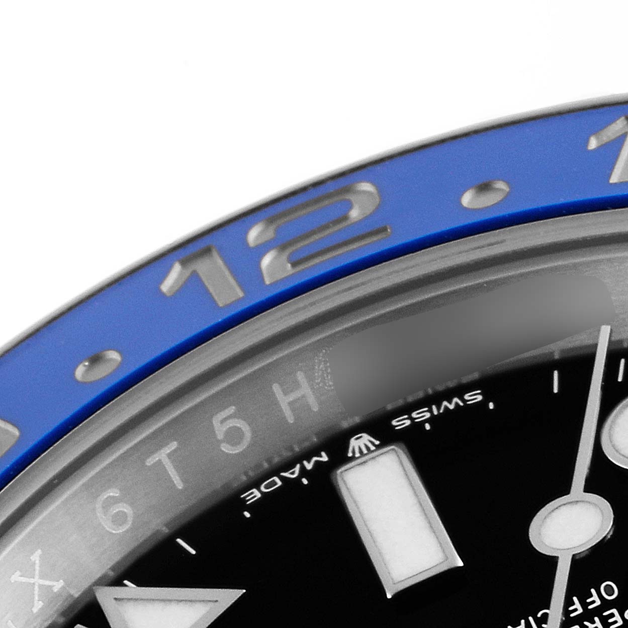 This close-up image shows the upper right section of the blue bezel, dial, and markers of a Rolex GMT-Master 126710 Men
s Stainless Steel Black Dial 126710 Men
s Stainless Steel Black Dial watch.