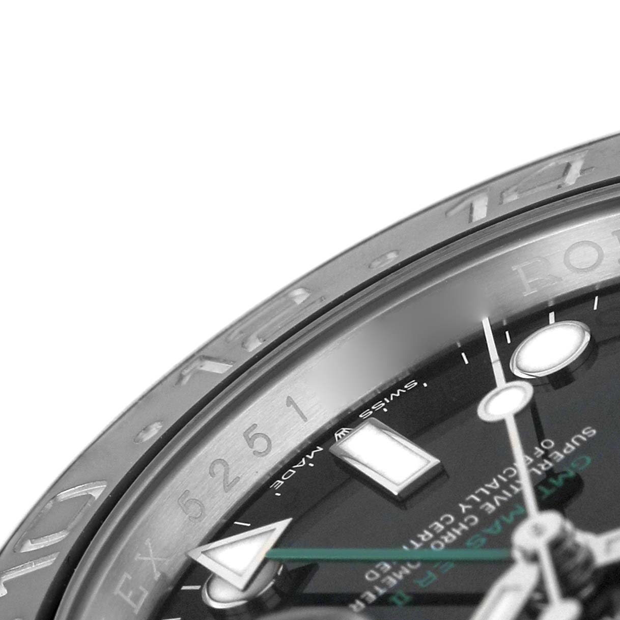 The image shows a close-up of the Rolex GMT-Master 126710 Men's Stainless Steel Black Dial watch, highlighting the bezel and partial dial with its markers and hands.