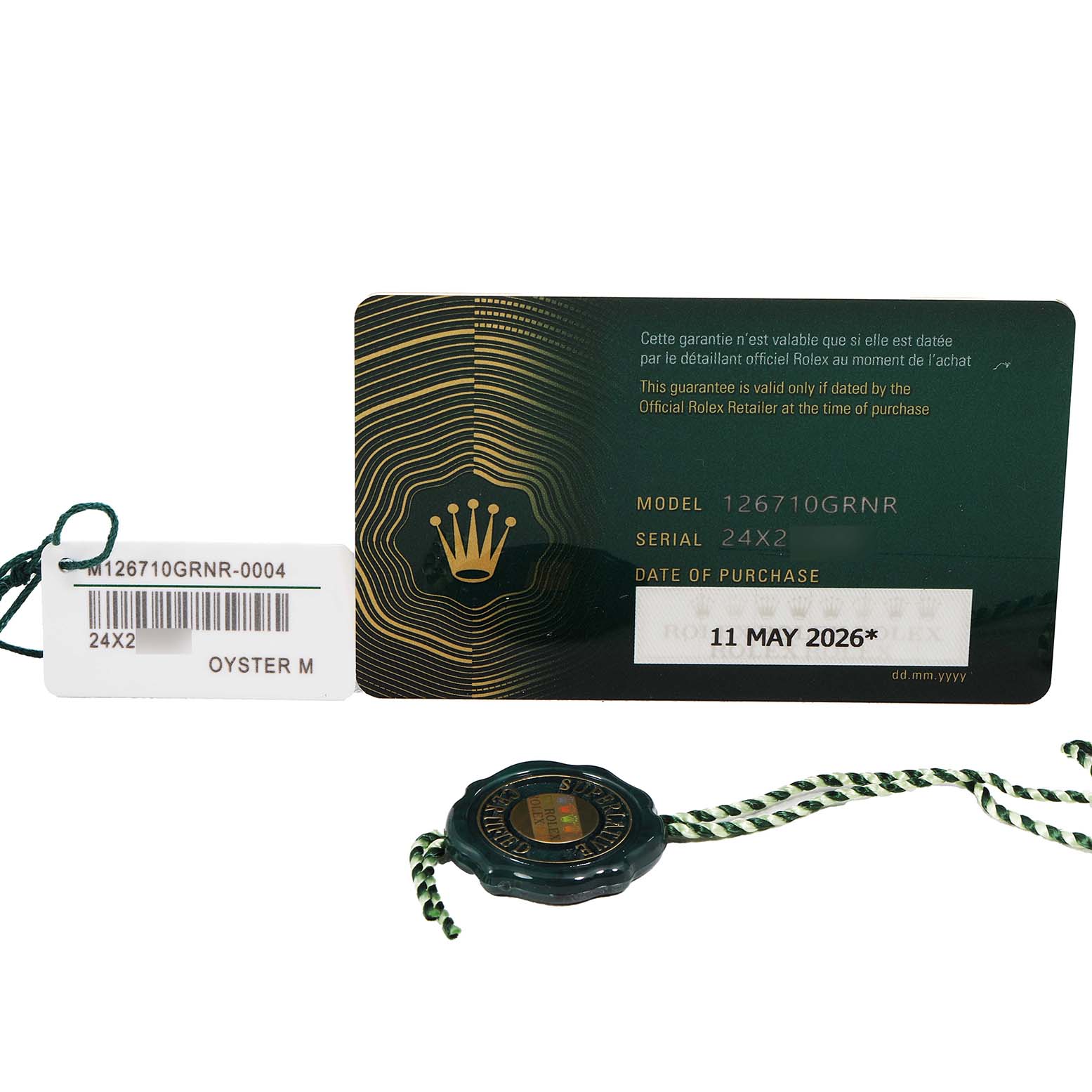 The image shows the guarantee card, tag, and seal for the Rolex GMT-Master 126710 Men's Stainless Steel Black Dial model 126710GRNR.