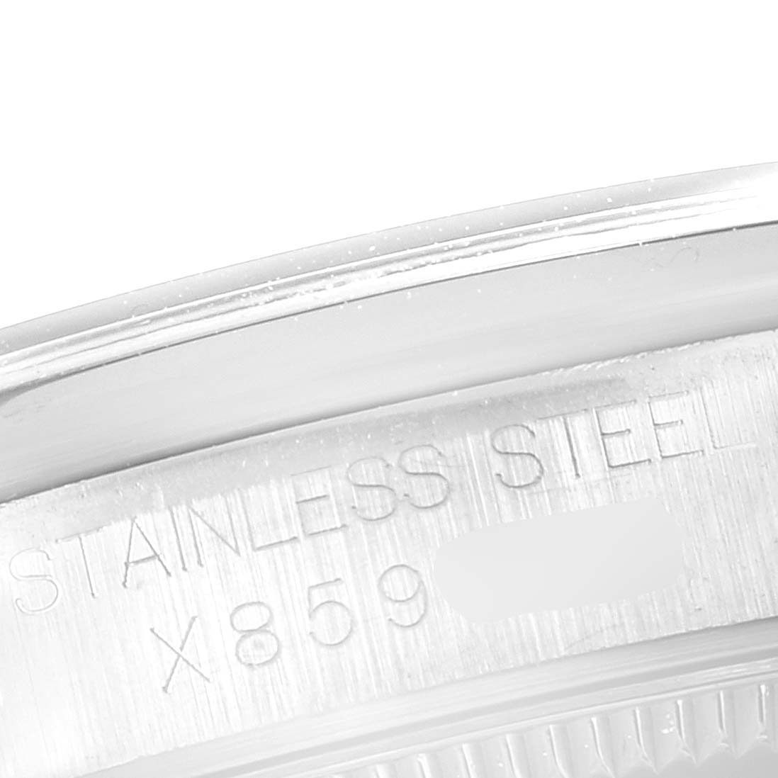 The image shows a close-up of the stainless steel case with inscriptions on the side of a mid-size Rolex watch.