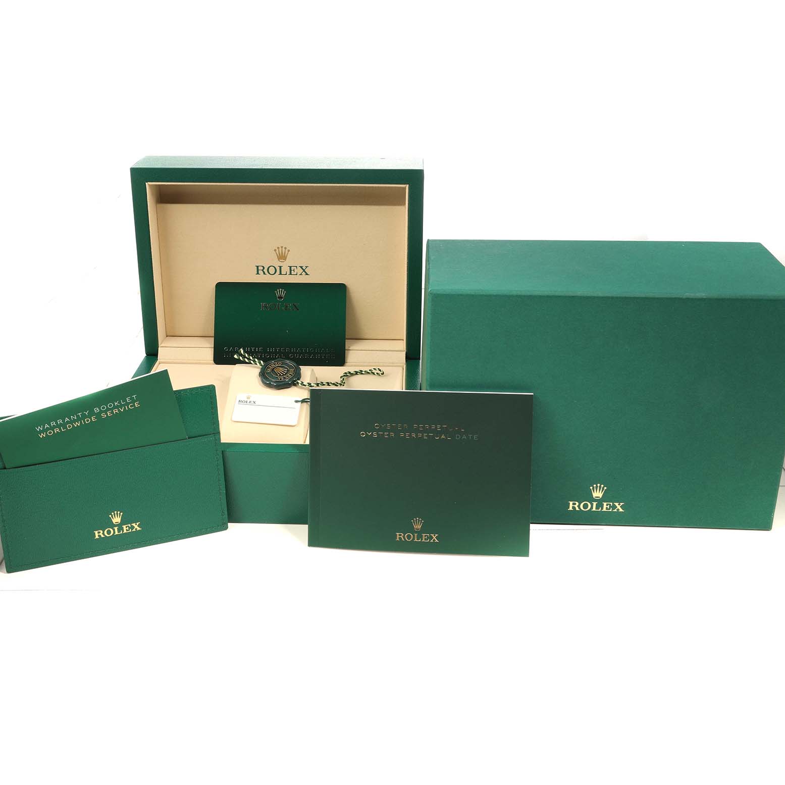 The image shows the packaging and documentation for a Rolex Oyster Perpetual 124200 Men's Stainless Steel Silver Dial, including boxes, booklets, tags, and a warranty card.