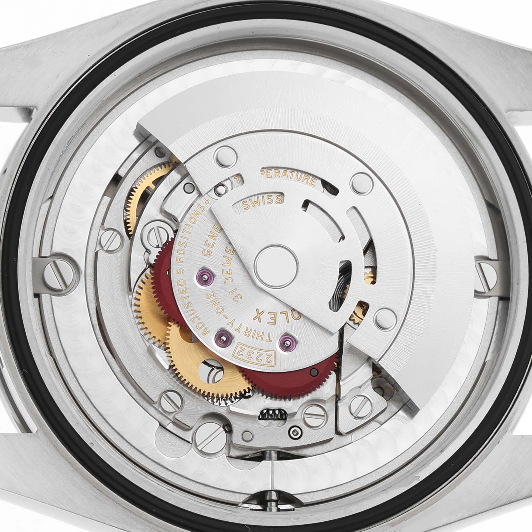 The image shows the movement mechanism of a Rolex Oyster Perpetual 124200 Men's Stainless Steel Silver Dial watch from the back, highlighting gears and the rotor.
