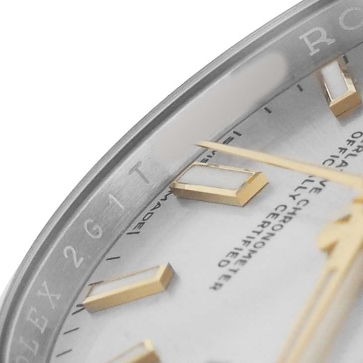 The image shows a close-up of the Rolex Oyster Perpetual 124200 Men's Stainless Steel Silver Dial watch face, focusing on the dial, hands, and part of the bezel.