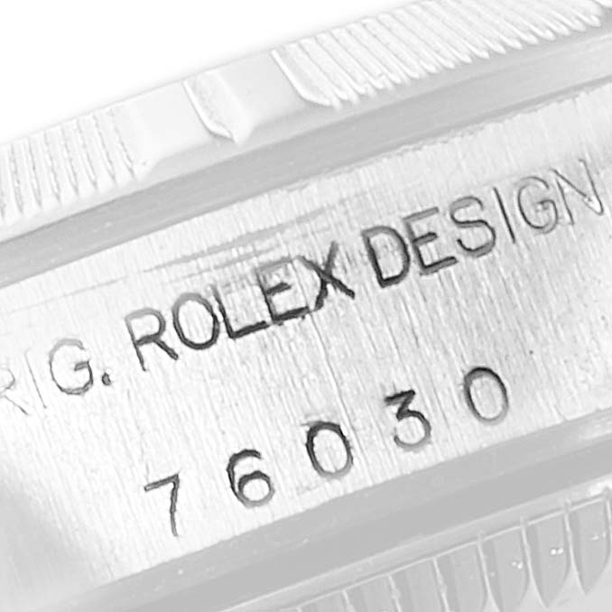 The image shows a close-up of the case side of a Rolex Oyster Perpetual 76030 Women
s Stainless Steel White Dial 76030 Women
s Stainless Steel White Dial watch, highlighting the engraved model number.