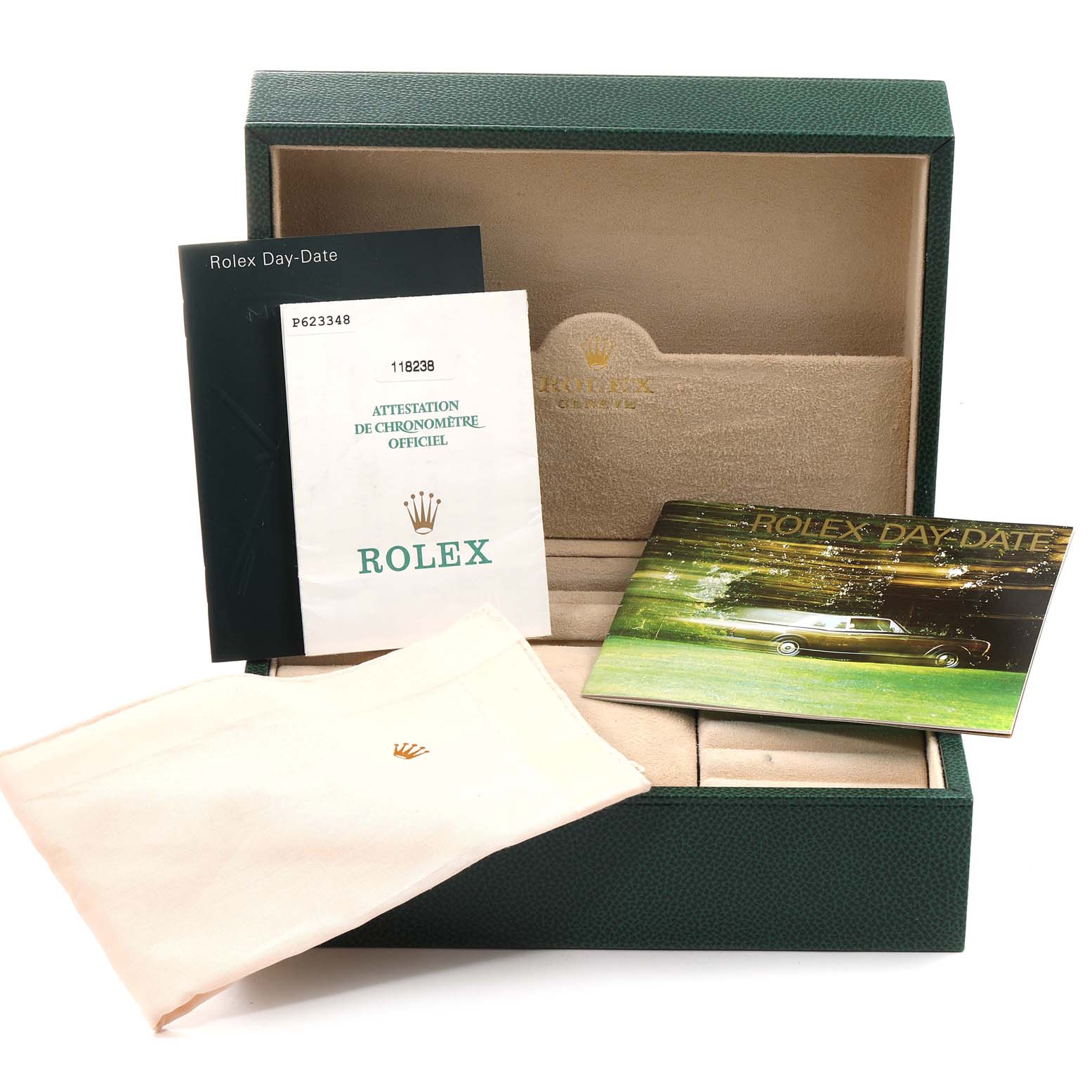 The image shows the packaging and accessories for a Rolex President 118238 Men
s Yellow Gold Champagne Dial 118238 Men
s Yellow Gold Champagne Dial model, including a box, manuals, and cloth.