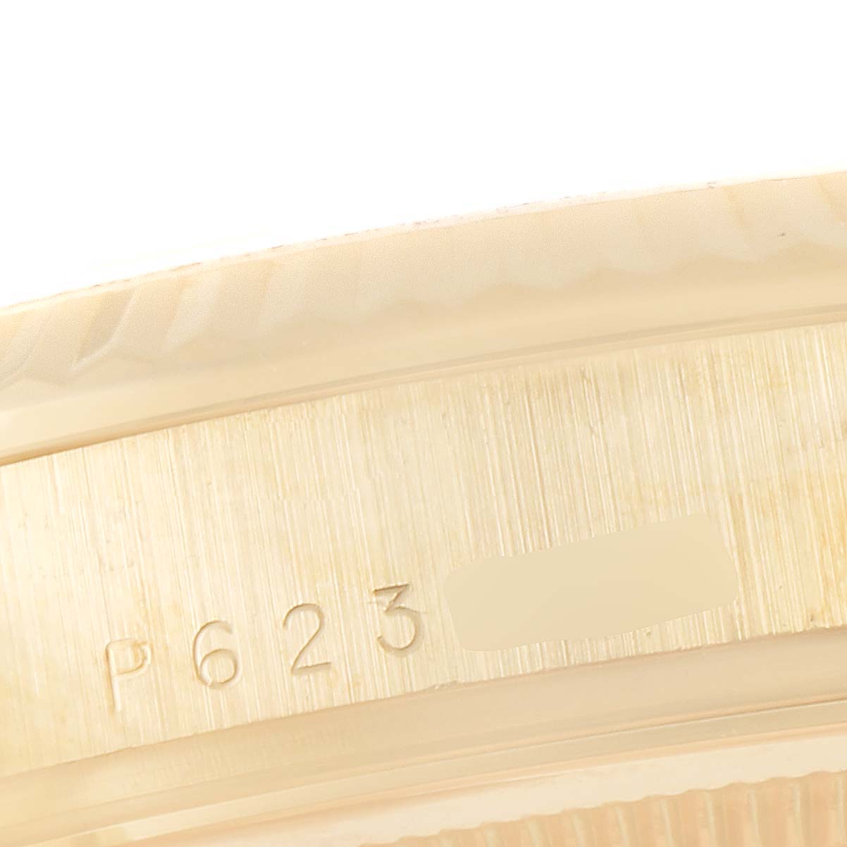 This image shows a close-up angle of the side case with engravings on a Rolex President 118238 Men
s Yellow Gold Champagne Dial 118238 Men
s Yellow Gold Champagne Dial model watch.