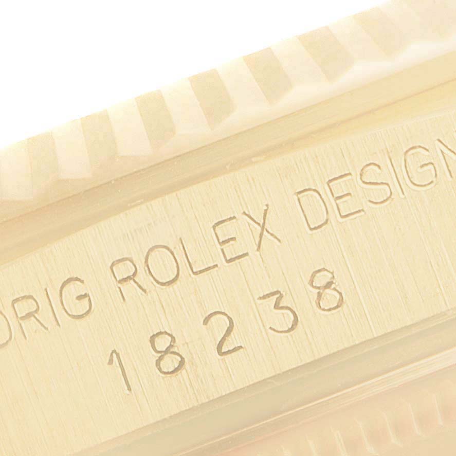 This image shows the inner side of the bezel and the engraved serial number of a Rolex President 18238 Men
s Yellow Gold Champagne Dial 18238 Men
s Yellow Gold Champagne Dial model watch.