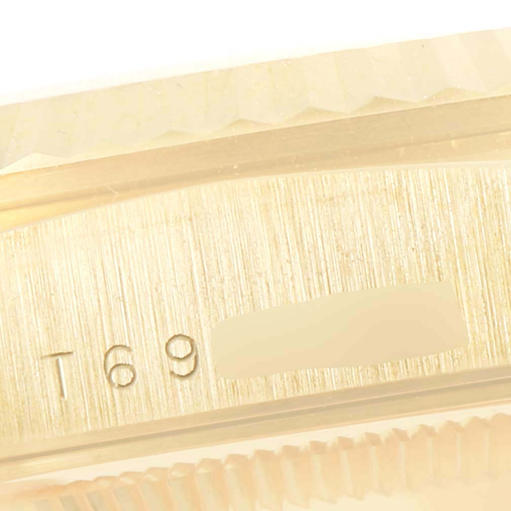 The image shows a close-up of the engraved serial number area on the case side of a Rolex President 18238 Men
s Yellow Gold Champagne Dial 18238 Men
s Yellow Gold Champagne Dial model watch.