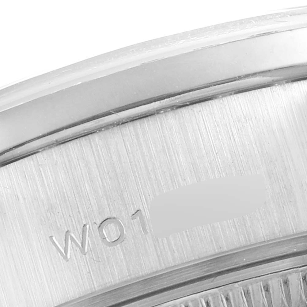 The image shows a close-up view of the Rolex President 69159 Women's White Gold Silver Dial 69159 Women's White Gold Silver Dial's watch case, including part of the serial number engraving.