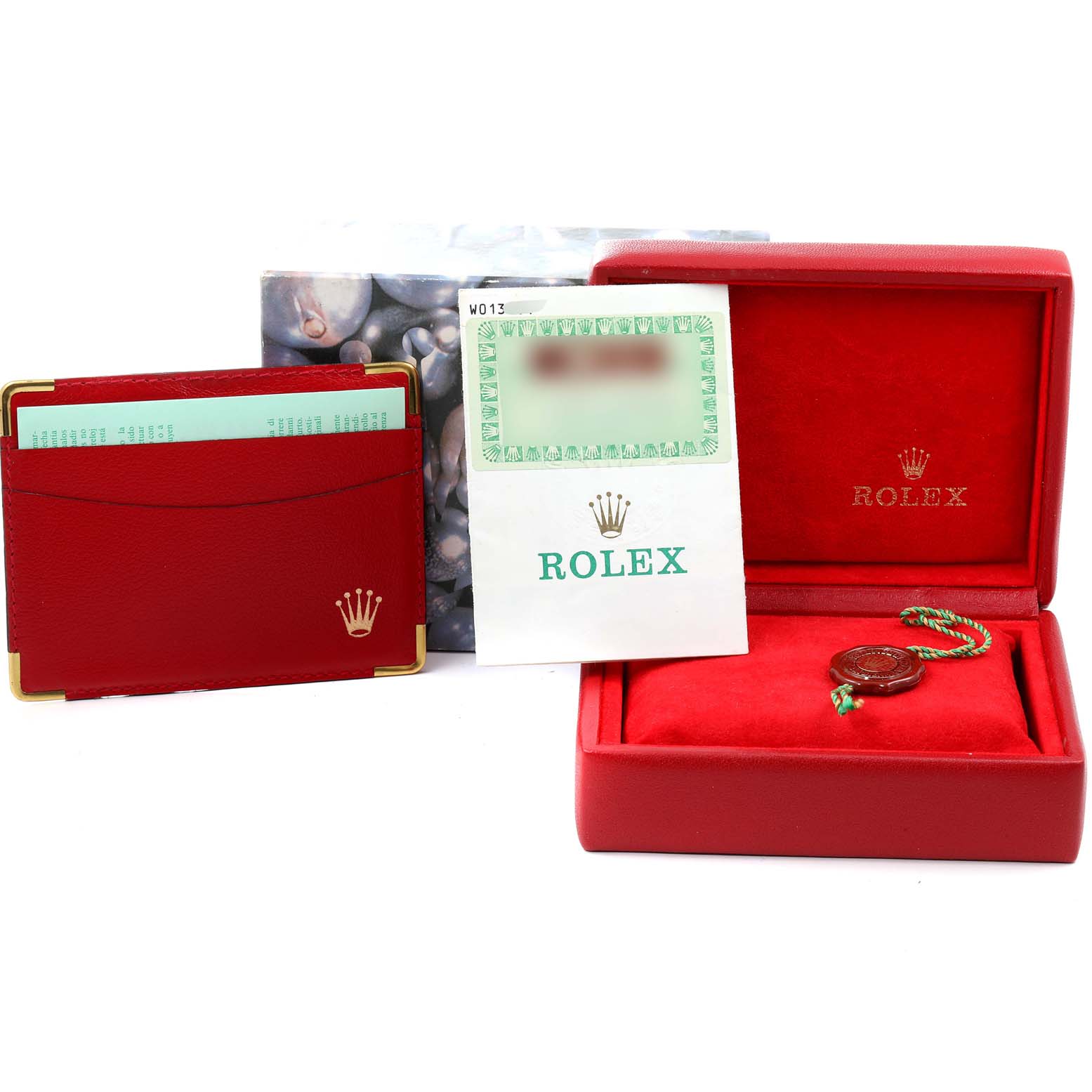 The image shows the accessories of a Rolex President 69159 Women's White Gold Silver Dial 69159 Women's White Gold Silver Dial model, including the box, papers, cardholder, and seal, all from a front angle.