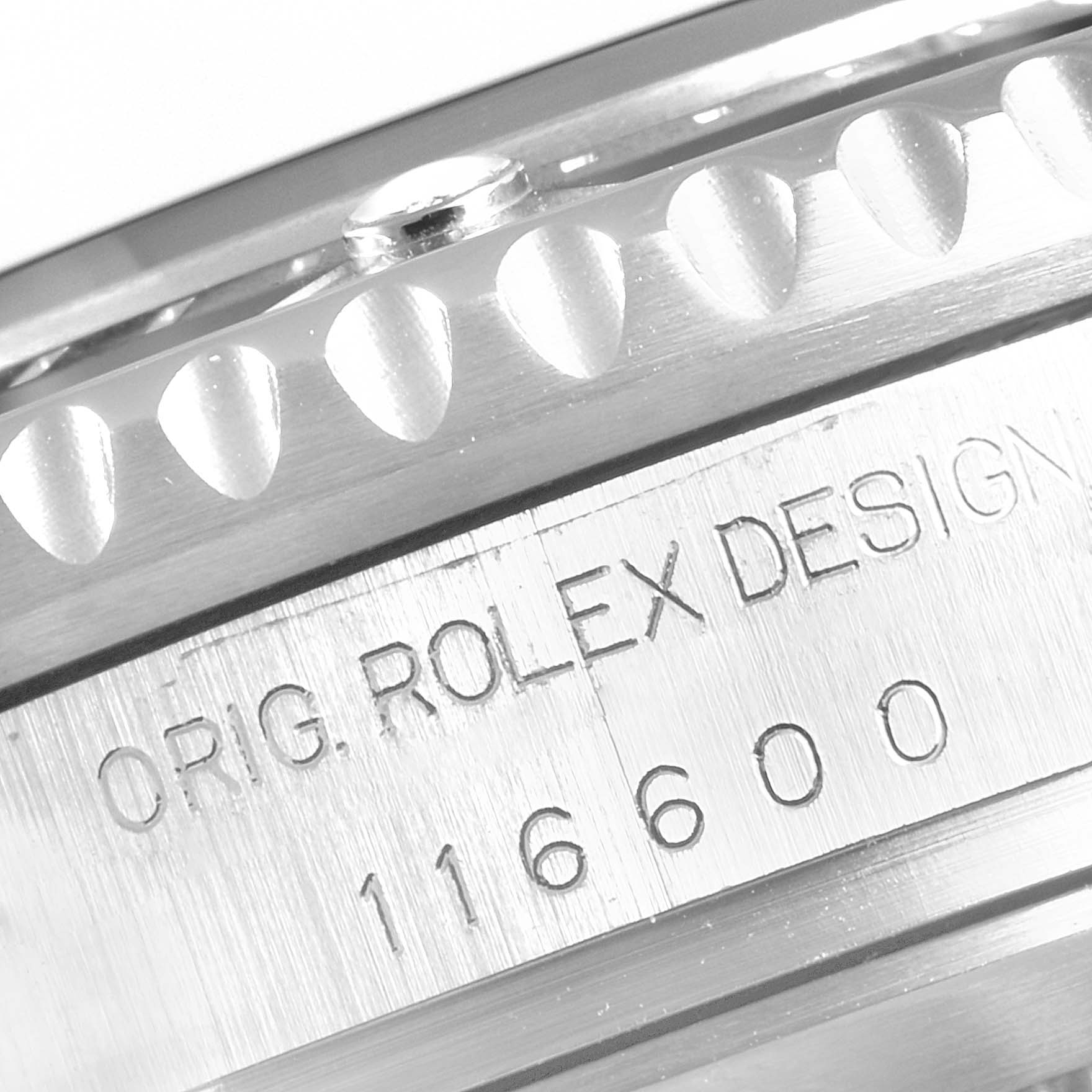 This close-up image shows the engravings and part of the bezel of a Rolex Sea-Dweller 116600 Men's Stainless Steel Black Dial 116600 Men's Stainless Steel Black Dial model 116600 watch.